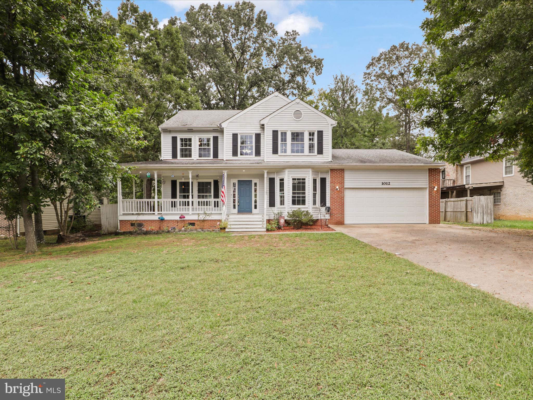 Rarely available in Aquia Harbor***Victorian Colonial Charm with Modern Comforts***Step into timeless elegance with this immaculate three-story Victorian Colonial, complete with a wrap-around country porch—perfect for rocking chairs, morning coffee, and evening conversations.  The heart of the home is the spacious eat-in kitchen, featuring granite countertops, a center island, and room for family gatherings or casual meals. Just off the kitchen, the hardwood family room offers soaring vaulted ceilings and a wood burning fireplace, creating a warm, inviting space for cozy evenings.  The main level continues with a formal dining room for holidays and celebrations, a bright living room ideal for entertaining, and a private library/office—perfect for working from home or quiet reading.  Upstairs, retreat to the owner’s suite, where a spa-inspired bath awaits with a separate shower and soaking tub. Additional bedrooms provide comfort and flexibility for family or guests.  The finished lower level adds even more living space with a recreation room, den/workshop, and half bath, making it a versatile area for hobbies, fitness, or movie nights.  Set on a prime lot with easy access to I-95, Route 1, and commuter lots, this home combines everyday convenience with the charm of classic architecture.