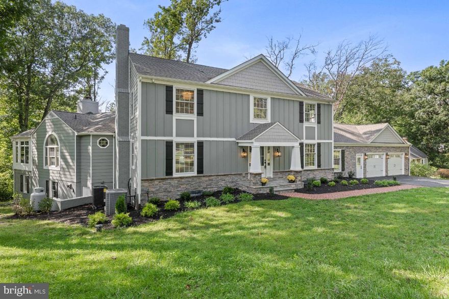 PRICE IMPROVEMENT - NEWLY Renovated in Chapel Ridge, nearby Baltimore Country Club’s Five Farms golf course - this Exquisite Chapel Ridge Renovation offers all the modern amenities of new construction, accompanied by the charm of an established neighborhood.  Completely transformed from the inside out, this modern twist to the classic colonial boasts over 6,000 square feet of finished living space, with four bedrooms, three and a half baths, and four fireplaces.   The exterior features a handsome Hardie plank and fabricated stone façade, a new 30 year asphalt shingle roof, a new composite deck, and a freshly paved driveway.   The main floor has been reconfigured to create a sophisticated gourmet kitchen that features a large island, four chic pendent lights, stainless steel appliances, farm sink, quartz counters and backsplash.  Adjacent to the kitchen, is a large dining area/breakfast room, featuring a stylish coiffured ceiling, and fireplace.  Flexible in design, this room could function as a formal dining room, or an informal breakfast room with extra space for seating.  The mudroom/laundry room combination offers built-in storage lockers, and access to the two-car garage, with plenty of extra storage space in the loft.  From the kitchen, new Anderson French doors open to the spacious composite deck, with room to lounge and dine in privacy.  Relax and enjoy your morning coffee on the covered portion of the deck, overlooking the rear yard.    The home offers two primary suites, one is located on the main level and the second one is on the upper level.   The main level primary suite features a wood burning fireplace, and a luxurious full bath with walk-in shower, double vanity sinks and walk-in closet.  Just past the main level primary suite, you’ll find the expansive family room, which serves at the heart of the home.  The family room features gorgeous custom built-ins, high ceilings, and a wood burning fireplace.   The fireplace is shared with the adjacent sunroom. The sunroom is perfectly situated towards the southwest corner of the home, maximizing the afternoon’s natural light.   On the second level, you’ll find the second primary suite and two additional bedrooms.  The primary suite on the second floor has a fireplace and luxurious spa-like bath, with double vanity sink, and a deluxe walk-in shower, rain shower head and hand held shower.   The massive lower level is newly carpeted; dry walled, and offers endless entertaining opportunities.