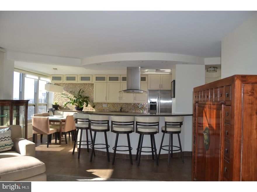 Exquisite corner deluxe one bedroom with two private terraces located in the desirable Dorchester on Rittenhouse Square! You will love this open floor plan! Not one detail was spared in the renovation of this condominium! The kitchen features a large breakfast bar, Bosch appliances, Silestone Quartz countertops, an induction cooktop, range hood, built-in microwave, beautiful tile backsplash, porcelain flooring, tons of cabinets, and a separate dining area. The living room overflows with natural light and has terrace with stunning unobstructed views. The spacious bedroom is complete with a walk-in custom closet, built-in desk, and another terrace. The bathroom offers a custom vanity with ample storage and a large shower with a frameless door. This home has custom window treatments throughout. The Dorchester has a seasonal rooftop pool with 360 degree views, a gym, and 24HR doorman. Valet Parking can be rented for only $261/mo. The rent includes ALL utilities and basic cable.  There is a one time move in fee of $300.  Walk out and enjoy living on beautiful Rittenhouse Square and all having all of the city's finest restaurants, cafes, and shops at your fingertips!