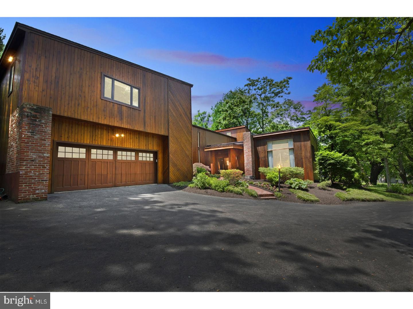 Sun-lit through walls of windows this Stunning Home is set on over an acre of manicured grounds, on a coveted tree lined street in Villanova. Approach down a long driveway, perfectly situated to bring the outside in, and thoughtfully designed for indoor/outdoor living w tiers of decks overlooking the picturesque grounds. Double entry doors open into the home where you are greeted w Soaring ceilings, and a wonderful Open Floor Plan. NEW Designer Eat-In Kitchen w seated island, custom white cabinetry, gleaming quartz counters, thermador side by side 36" refrig & 36" freezer, Professional cooktop, and all new stainless appliances and accent shelving. New Hardwoods and vaulted ceilings throughout the Kitchen, Breakfast rm & Family rm area where sunlight streams in the multiple windows & skylights. Family rm w cozy corner Gas FP, and Breakfast rm which opens onto the deck. A barn door slides between the kitchen pantry and butler's pantry leading you to the spacious Dining Rm w Glass sliding doors for seamless indoor/outdoor entertaining. Elegant Living Rm w wood burning FP, Soaring ceilings and wall of Glass Doors. French doors open into the Entertainment Rm w vaulted ceilings, exposed wood beams, huge windows, custom built-in entertainment center w display cases, and Gorgeous NEW Full Bath w vanity sink & tub/shower. Through a separate entry is a 1st FL In-Law/Au-Pair Suite w ample closet space, Full Bath, and Office/Living Space. A Newly Renovated powder rm, a mudroom, and laundry area are conveniently accessible from the generous 2-car garage. Ascend a skylit stairway to the Master Suite, a Retreat complete w Spa-like Bath including limestone floors, Steam Shower, Whirlpool tub, double vessel sinks. Master Bed has vaulted ceilings, stone fronted dual sided ?FP? which graces the sitting area w private deck overlooking the property, and the Bedroom with huge walk-in custom closet. 4 Additional spacious bedrooms w generous closets and 2 full baths complete this level. The lower level offers a recreation room and separate game room, as well as additional storage areas. Award Winning Lower Merion Schools, an easy commute to center city and everything the Main Line offers.