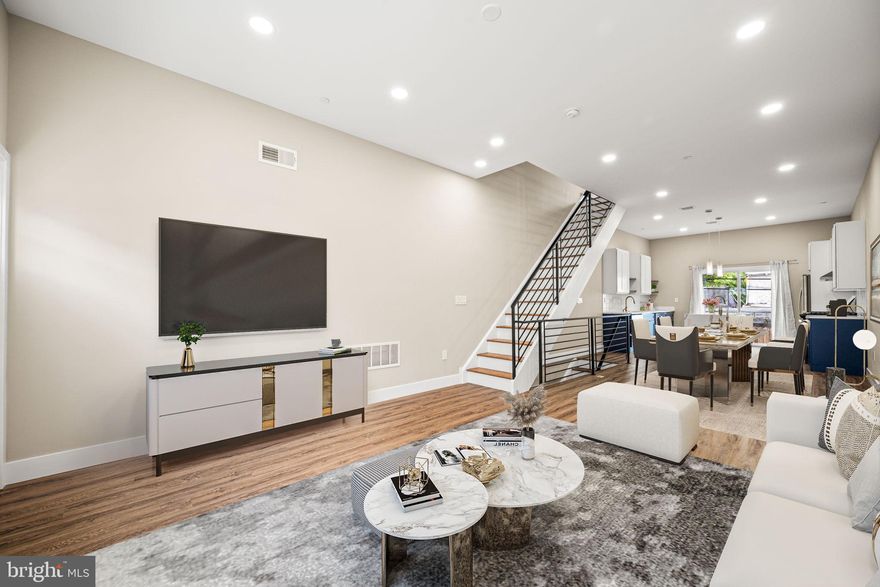 Don’t miss the last of two exceptional new construction homes in the highly desirable Mt. Airy neighborhood—where timeless design meets modern convenience. Welcome to 6210 Clearview Street, a beautifully crafted 3-bedroom, 2-bathroom residence that blends style, comfort, and value in one of Philadelphia’s most sought-after growth areas. From the moment you walk in, you’re greeted by a sun-drenched main floor featuring soaring 10-foot ceilings and an open-concept design that makes every space feel expansive and welcoming. The living area flows effortlessly into the dining space and a chef-inspired kitchen, thoughtfully appointed with a full stainless steel appliance package, sleek range hood, white shaker upper cabinets, rich navy blue lower cabinets, and stunning waterfall quartz countertops on a large center island—perfect for entertaining or casual family meals. Glass sliding doors open to a private grassy backyard, creating an easy indoor-outdoor connection ideal for grilling, gardening, or relaxing. Upstairs, two spacious secondary bedrooms share a spa-like hall bathroom with dual vanities and a soaking tub, while a side-by-side laundry area offers everyday convenience. The private third-floor primary suite is a luxurious retreat with a custom walk-through closet and an elegant en-suite bath featuring a frameless glass walk-in shower and dual vanities. Just outside your bedroom, a bonus flex space with a built-in wet bar and wine fridge is perfect for morning coffee or evening cocktails before stepping onto your expansive rooftop deck with Trex decking and breathtaking 360-degree views, including stunning sunsets. The unfinished basement provides abundant storage or the potential to customize into a gym, office, or additional living space.Located just blocks from Germantown Avenue’s shops and dining, minutes to Chestnut Hill, Center City, and Fairmount Park, with easy access to major highways and public transportation, this home delivers the best of city living in a vibrant, fast-growing neighborhood.Unbeatable Builder Incentives & Warranty: Enjoy peace of mind with a 1-year comprehensive builder warranty, ensuring top-quality craftsmanship and service. For a limited time, take advantage of a special builder financing incentive—interest rates as low as 4.99%—a rare opportunity to lower your monthly payment significantly! Plus, receive the benefit of a FULL 10-year tax abatement, offering substantial long-term savings and making this an even smarter investment. New construction of this caliber, location, and value is extremely limited—schedule your private tour today before this last opportunity is gone!