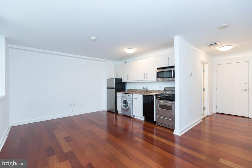 Designer studio bathed in natural light through south-facing windows at Parc Rittenhouse on Rittenhouse Square. This beautifully appointed home features an open kitchen with stainless steel appliances, modern cabinetry and granite countertops; generously sized living area; an oversized marble appointed bathroom with a shower/tub; Brazilian cherry hardwood floors; and combination washer/dryer. Residents of Parc Rittenhouse enjoy world class amenities and services including a 24 hour doorman; an amenities suite that includes a brand new state-of-the-art fitness center and resident lounge with pantry; media room; outdoor rooftop pool club with a large pool deck, full size pool, kids pool and hot tub; garage parking below the building for an additional fee; and two amazing restaurants on the ground floor, Stephen Starr’s Parc and Via Locusta.