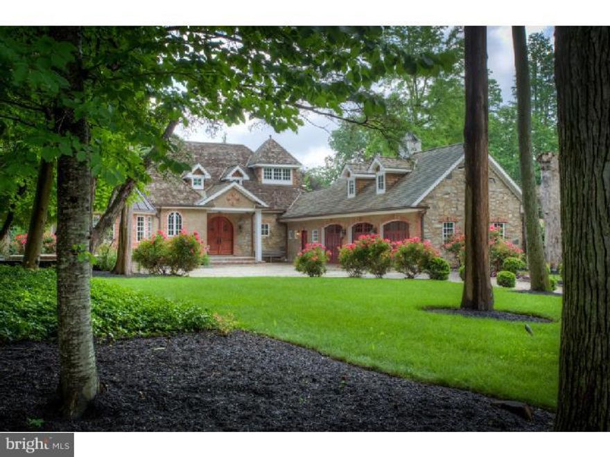 Best of Both Worlds: Exquisite Custom Chestnut Hill home with European Flair in Springfield Township Montgomery County. This Home is located on what is widely regarded as one of the most visually spectacular and appealing areas in the greater Chestnut Hill Area.    This meticulously designed Estate is set back from a quiet tree lined one way road, steps away from Fairmount Park.  Drive up the long gravel/cobble-edged driveway and you are greeted with a custom courtyard entry, impeccably designed brick arched front entrance with Custom Double Mahogany doors, a side entrance & 3 car attached garage with Mahogany doors. This home was designed for easy living, entertaining & allows additional living space in several areas of the home for more Bedrooms, Office etc and further enhance your needs. The Foyer opens into the Great Room with 18 ft foldout Glass Track door system which gives a view of the serene back yard. The Dining area has custom granite butlers pantry, built-ins and wine refrigerator plus French doors to a side Patio. The Living room/study has built-ins and a wood burning fireplace which can be seen from the Great room.  A Gourmet Kitchen with Viking gas cooktop, warming drawer, built-in Sub Zero refrigerator, beautiful turret for breakfast area with fabulous views and a spiral staircase that descends to a candle-lit wine cellar will highlight your guests evening.  The First floor has extinct reclaimed Chestnut flooring with Radiant Heat on the entire main level.  Two first floor master suites have large walk-in closets, gas fireplaces, full Custom Baths, one with steam shower and double vanity and the other with whirlpool tub complete the Main Level.  The 2nd Floor includes 2 bedrooms, a large full bath and ample closets. All this and Radiant heating on entire first floor, prewired for Sonos sound system, four zone cooling, first floor laundry room, Large mudroom, 50 year Pressure treated cedar roof, Finished lower level with 9 foot ceilings and bamboo flooring and 2 additional rooms which can be finished for Fitness Center, Office, Playroom etc.  Lower level also has Access thru a secret passage to the custom brick accented Wine cellar with large dining area adds to the unique charm of "Villa Val Vert." Steps to Valley Green/Fairmount Park, Northwestern Stables, Morris Arboretum and all the wonderful amenities Chestnut Hill has to offer!