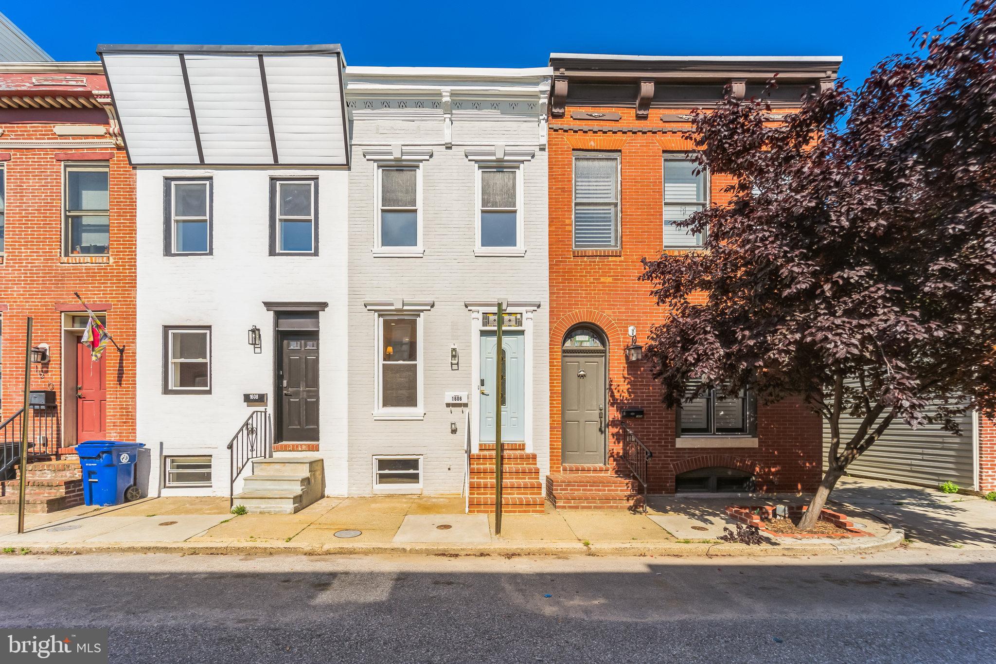 Welcome to 1606 Patapsco St, a beautifully renovated townhome nestled in the heart of Federal Hill. This stunning home offers 3 bedrooms, 3.5 bathrooms, a finished basement with a bonus room, and brand-new hardwood flooring throughout. The stylish kitchen features sleek stainless steel appliances and flows seamlessly into the open-concept living and dining area. On the main level, you'll find a convenient half bath and access to a spacious private patio. The fully finished basement provides additional living space, while two upstairs bedrooms have private balconies. The third-floor primary suite boasts a walk-in closet and a beautifully designed en-suite bathroom. Thoughtful details and high-end finishes are showcased throughout the home. To top it all off, the brand-new rooftop deck offers breathtaking city views. Don't miss this incredible opportunity to own a one-of-a-kind home in a prime location! Additional upgrades include a new HVAC, washer/dryer, patio, bathrooms, kitchen, roof, paint, hardwood floors, finished basement, and rooftop decks —everything you need for comfortable city living.
