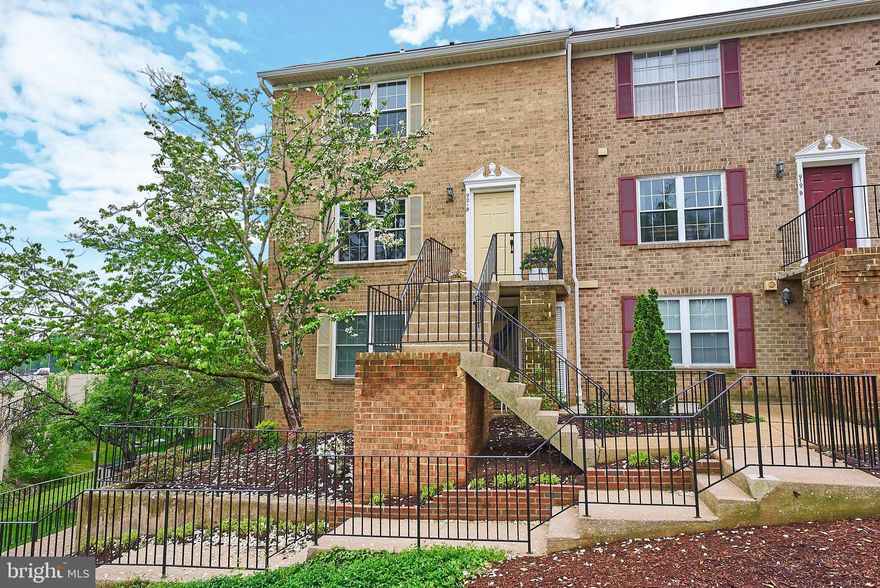 Enjoy this bright, upper level townhome style condo in a convenient Arlington location. This end unit, with its new windows, warmly invites friends and family to stay. Some of the highlights include luxury vinyl floors on the main living level, recessed lights, a wood burning fireplace, open floorplan, a deck for alfresco dining, attic storage and parking. The main level has windows on 3 sides and the open floorplan creates an inviting home for gathering or just relaxing and enjoying the skyline views. The eat-in kitchen has granite countertops and stainless steel appliances. The primary suite is large and easily accommodates a set of bedroom furniture. The other 2 bedrooms are spacious and the hall bathroom has been updated with new tile and vanity. This home has a stately brick exterior and is located adjacent to Towers Park which has ball courts, a new playground and a dog park. The Westhampton Mews offers easy access to major roads, the Pentagon and DC.