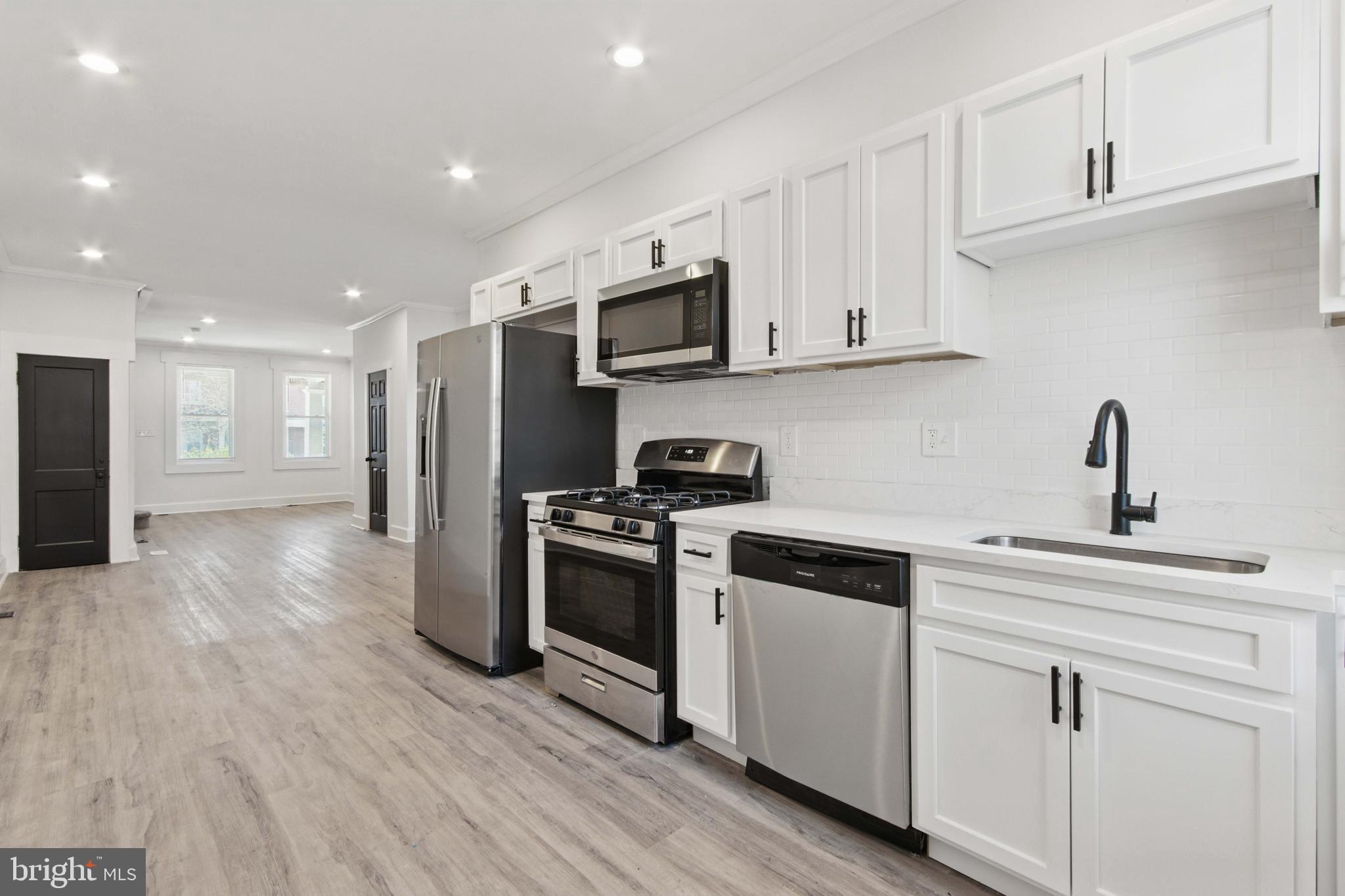 Stunning Fully Remodeled Home in Mosher Neighborhood!
Welcome to this beautifully renovated 3-bedroom, 2.5-bathroom home in Baltimore City's Mosher neighborhood! Step inside to find modern elegance, featuring LPV flooring throughout, recessed lighting, and an open-concept design perfect for entertaining. The kitchen boasts stainless steel appliances, sleek countertops, and stylish cabinetry.
Enjoy a spacious primary suite well-appointed bathrooms, and ample natural light in every room. Relax on the charming front porch or take advantage of the home's convenient location—just minutes from the MARC Station and public transportation for an easy commute.
Don’t miss out on this move-in-ready gem—schedule your showing today!