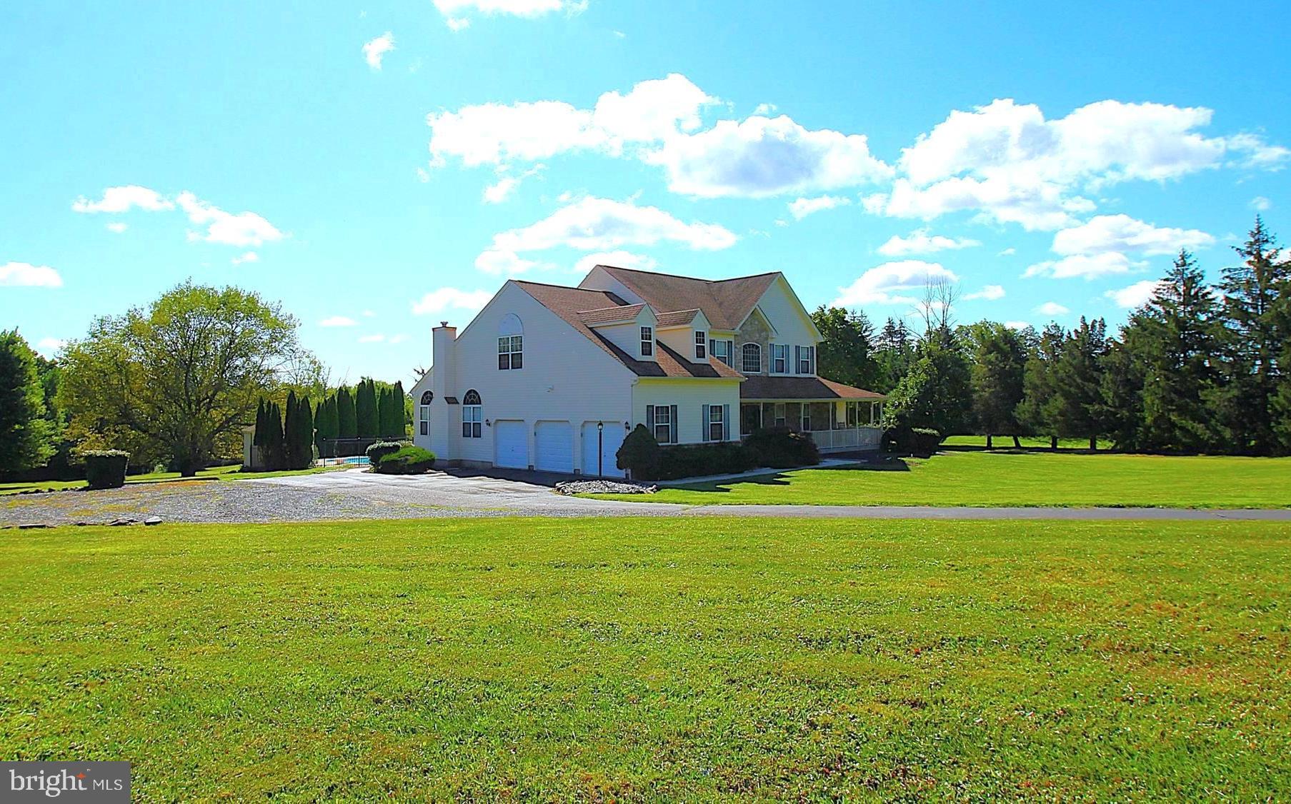 This custom built, multi-wing estate is situated on a private, secluded lot that is just shy of four and a half acres, has over 5000 square feet of living space, and is ideal for multi-generational living and entertainment versatility. You'll find two story ceilings in the foyer, the North and South wing living rooms, master bedroom and South wing kitchen. Off the South wing kitchen is a sunroom with gorgeous views of the expansive estate grounds, stairs to the loft/office area, and a sliding door leading to its own patio that overlooks the pool. A first floor bedroom with en-suite bathroom and walk in closet along with a secondary entrance from the covered front porch makes up the rest of the South side of this home. Upstairs you'll find the master bedroom which also features an en-suite full bathroom, walk in closet with additional storage area, as well as a secondary sitting area that overlooks the North wing living room down the spiral staircase. Three more bedrooms each with ample closet space and plenty of natural light, a laundry chute, and another full bathroom complete the upstairs. The finished basement can be accessed from either wing, through separate entrances and boasts a theater room, built in bar, recessed lighting, wired sound, and access to the outside rear patio. Half of the basement is unfinished providing plenty of storage space if needed. Out back is a sprawling patio, custom in ground pool, equipment house, professional landscaping, and scenic views that take your breath away. A storage shed, oversized three car garage, with a whole house generator add peace of mind and functionality to this move in ready property. A prime location within Central Bucks School District right in the heart of Chalfont, with the perfect balance of privacy, peace and quiet, and short commutes to all the shopping, dinning, and entertainment the area has to offer. Request your private showing today and make these incredible views yours to look at every day. First showing available is Sat Sept 6th!