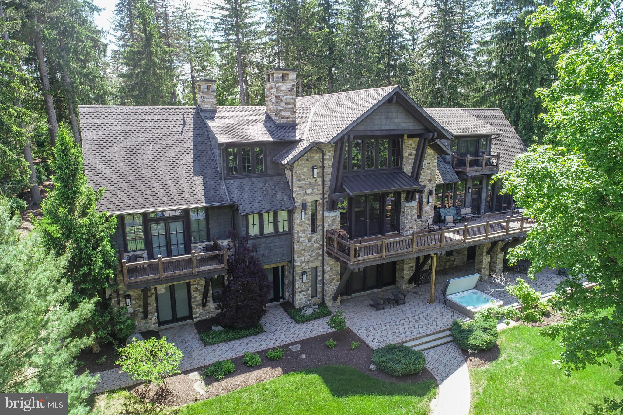 ICONIC. A design masterpiece of stone and timber — a true Rex Anderson build that reflects the seamless merging of inspiration and architecture. Warm, and undeniably welcoming, this home stands as a statement of craftsmanship and vision.
Discover a breathtaking blend of contemporary luxury and timeless timber frame construction, perfectly positioned for privacy within the prestigious Reserve at Holy Cross. Surrounded by soaring pines and set against the sparkling backdrop of Deep Creek Lake, this architectural gem offers a flawless fusion of indoor elegance and outdoor serenity.
Step inside to soaring exposed beam ceilings, floor-to-ceiling windows, and open, airy living spaces. The great room centers around a striking floor-to-ceiling stone fireplace, complemented by handcrafted timber details and expansive glass doors that open onto a sprawling lakeside deck.
The chef’s kitchen is a modern centerpiece, featuring high-end appliances, granite countertops, custom cabinetry, and a generous island perfect for gathering with family and friends. The primary suite is a luxurious retreat, a spa-inspired ensuite, and dream walk-in closet.
Throughout the home, no detail has been overlooked — from hardwood trim, solid wood doors, all of which, are hand-selected finishes that speak to quality and intention. Additional features include a fully equipped home gym and an energy-efficient geothermal system, ensuring sustainable comfort year-round.
Set on 1.3 acres with 160 feet of pristine waterfront, this exceptional property delivers both privacy and proximity to Deep Creek Lake’s finest amenities — from boating and skiing to dining and golf.
This is more than a home. It’s a lifestyle. A statement. Welcome to your lakefront legacy.