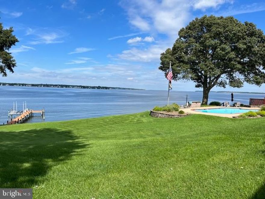The owners say "This is a Happy Home with lots of wonderful memories"  Spectacular expansive views of the Patuxent River across to Solomons. Close to shopping and the Naval Air Station for an easy commute, & unparalleled views of the Patuxent River!  Sitting high above the shore  with a gentle slope to the river and dock.  This home features huge windows that capture the stunning view.  Five bedrooms, three which are en-suite, plus large family room with stone fireplace and built in bar overlooking the river.  Just off family room is a three season room with two walls of windows for that wonderful view.  This home was designed with entertaining in mind.   A wonderful gourmet kitchen designed by Woodburn's Cabinets,  features two islands,  sub zero refrigerator, wall oven and cooktop along with loads of counter space Kitchen also has a breakfast area and sitting area with a corner fireplace.  Lower level family room features the third fireplace, a full bath along with a large laundry room plus a private home office on this level  and  access to the 2 car oversized garage.  The waterside also features an inground pool and hot tub,  plus your private 100 foot pier with boatlift. All of this on a large 1.25 acre lot that is perfect for summer gatherings.  Enjoy the fireworks in July and watch the Blue Angels fly all from your front yard!!