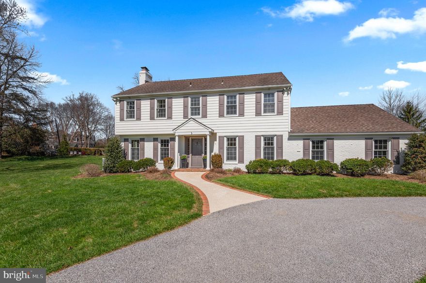 An exceptional private Ruxton location defines this beautifully renovated residence on a flat one acre lot.  A comprehensive 2006 renovation, includes a two-story addition that seamlessly blends timeless architecture with modern functionality. A gracious foyer opens to a sophisticated living room with fireplace and a formal dining room adorned with custom millwork and crown molding. Expansive Pella windows throughout the home bathe the interiors in natural light. At the heart of the home, the gourmet eat-in kitchen is designed for both everyday living and entertaining, featuring a generous island, six-burner gas range, dual sinks, and a dedicated beverage station complete with wine refrigeration and ice maker. The kitchen flows effortlessly into the  fabulous family room with fireplace and back staircase. French doors  open  to he welcoming screened porch. There is also a fantastic mudroom with a second powder room, stackable laundry for pool towels, and custom cabinetry. The upper level offers five spacious bedrooms, including a primary suite with a walk-in closet. A functional second-floor laundry room enhances daily living with ample cabinetry, a folding station, and a utility sink. The finished lower level provides versatile recreation and entertaining space, along with abundant storage and walk-out access to the grounds. Outdoor living is equally compelling, with a screened porch overlooking beautifully landscaped grounds and a sparkling saltwater pool—creating a private retreat ideal for relaxation and entertaining. Additional features include Hardiplank siding, a circular driveway, and an attached two-car garage.