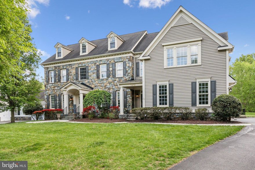 Fall in love with this picture perfect home nestled in the highly sought-after Bancroft Community. This extraordinary home, Mitchell and Best’s largest model “The Eagles Nest”, boasts roughly 9,000 square feet featuring unparalleled craftsmanship in every detail. Stepping into the grand two-story foyer, you are immediately captivated by designer accent moldings, elegant curved staircase and gleaming hardwood floors. The main level offers wall to ceiling windows and an abundance of natural light bringing the outside in. The gourmet kitchen is a chef’s dream equipped with top-of-the-line appliances, a central island with breakfast bar, custom backsplash, a walk-in pantry, double wall ovens, a six-burner gas range and a breakfast nook overlooking the immaculate grounds backing to community green space. The kitchen opens to the family room, where wall-to-wall windows, a soaring tray ceiling and a cozy stone gas fireplace invite warmth and sunlight. A private rear staircase ascends from the family room to the upper level. Entertain your guests in the cozy living room or the formal dining room located directly off the kitchen. French doors off the foyer opens to the private home office, perfect for refined work-from-home days. There is a convenient second exterior entrance leading directly to a welcoming mudroom and the homes' first laundry area, and adjacent to this space is a functional family work nook, ideal for homework and creative projects seamlessly blending practicality with comfort. The main level is complete with a powder room and interior access to the oversized three car garage. Upstairs you will find the luxurious owner’s suite with its tray ceiling, fireplace, step-down sitting room and two walk-in closets. The owners’ suite features a private balcony offering a serene retreat, perfect for enjoying morning coffee while overlooking the picturesque landscape, and a luxurious ensuite bath with a luxurious soaking tub, dual vanities, an oversized dual entry shower and elegant tile flooring. There are four additional bedrooms, including one with a private bath and two sharing a buddy bath. The thoughtfully designed bedroom-level laundry room adds convenience to daily chores, while the adjacent loft space, complete with built-in bookshelves, provides an inviting area for relaxation and reading. The fully finished lower level extends the luxury living experience, featuring two bonus rooms and two full bathrooms, a recreation room with a stunning custom bar, a game area, a media room and plenty of storage space. Walk-out stairs lead from the lower level to the private backyard with a beautifully hardscape patio and lush landscaping carefully maintained by the HOA. The gated Bancroft community provides a peaceful setting with miles of walking paths, sidewalks, and a central neighborhood park with a tot lot. This neighborhood was the recipient of the Maryland National Capital Building Industry Association Environmental Award and The National Arbor Day Foundations Building with Trees Award.