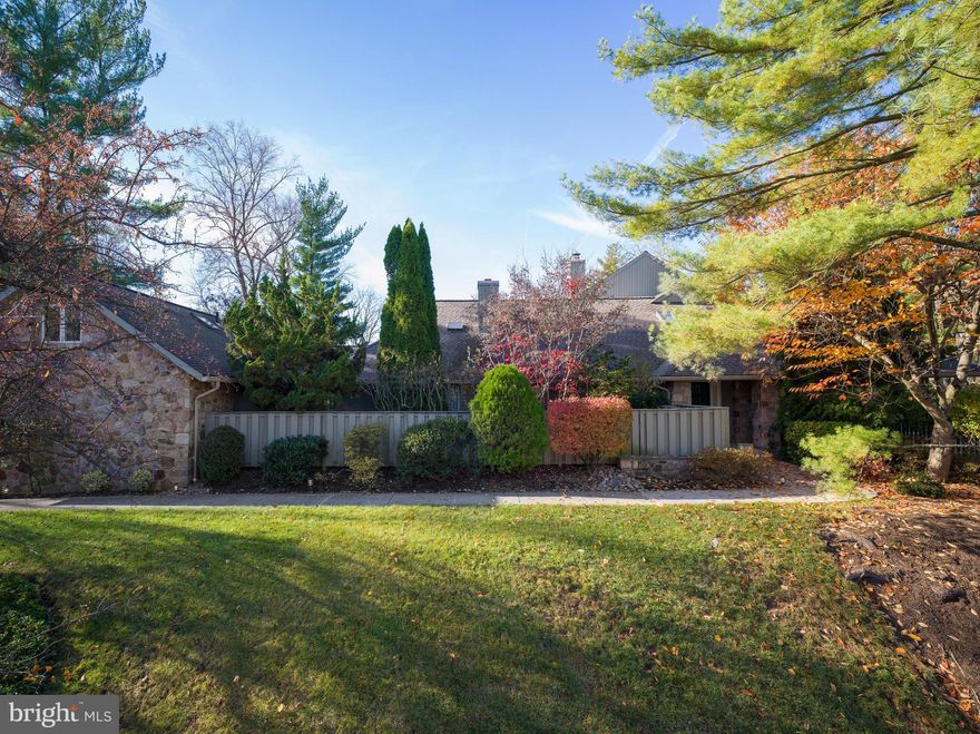 Welcome to 1270 Round Hill Rd, a highly desirable end-unit residence in the sought-after Hermitage community of Bryn Mawr offering an exceptional opportunity to customize a spacious home in one of the Main Line’s most prestigious settings. With generous square footage, timeless architectural details, and a flexible floor plan designed for both everyday living and entertaining, this property is ready for its next chapter.

One of only a few homes in the community with a natural gas line for cooking and heating, the home also offers interior access from the attached 2-car garage — a rare and highly desirable feature within the neighborhood. Additional major improvements include a whole-house generator and one newer HVAC system.

Inside, expansive living spaces are filled with potential, featuring marble flooring, multiple fireplaces, oversized windows, and sliding doors that open to a dramatic wrap-around two-story deck overlooking mature trees and peaceful surroundings. The kitchen offers abundant cabinetry, double ovens, a 5-burner gas cooktop, and ample prep space, providing a strong foundation for a future dream renovation.

The main-level primary suite allows for convenient first-floor living and includes an en-suite marble bath, private terrace access, and an adjoining flex space currently configured as a dressing room, office, and additional bath. The fully finished walk-out lower level expands the home’s versatility with a bar area, fireplace, bedroom, full bath, and direct patio access — ideal for guests, entertaining, or multi-generational living. A private en-suite guest room above the garage, walk-up attic storage, built-in shelving, and cedar closet add even more functionality.

Set within the prestigious Hermitage community, residents enjoy low-maintenance living surrounded by estate homes, mature landscaping, and close proximity to renowned schools, shopping, dining, and everything the Main Line has to offer. A rare opportunity to bring your vision to a luxury Bryn Mawr property with incredible bones, unique features, and endless potential.