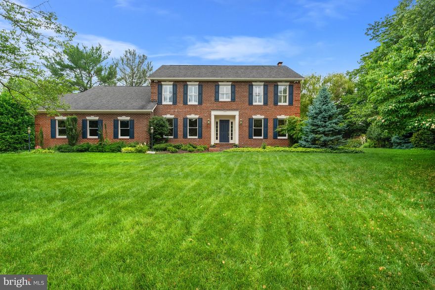 Settled in a quiet cul-de-sac, this beloved Condon Manor home offers a classic brick exterior and a 21st century interior, well-appointed for family living. This 1991 Federal has been tastefully renovated throughout its three levels and 4,850 square feet of living space with luxury fixtures and finishes including hardwood and stone flooring; custom cabinetry; marble and granite countertops; and recessed LED lighting throughout. The priority given to energy efficiency and air quality informed, but never compromised, every design decision. 

Welcome home to a broad expanse of greenery, an elongated driveway, and a landscaped walkway. Talk about curb appeal.  Two lighted dusk to dawn lamp posts guide your guests towards a large porch and recessed doorway. 

Or enter your home via your attached, side-loading, oversized 2-car garage into the family foyer hallway connecting the laundry room and den with an ensuite shower bath, ideal for presenting the best 2 (or 4) feet forward to the kitchen, family dining and living areas overlooking an expansive and private back yard. 

Guests entering the lighted front door would find an elegant foyer with Italian marble flooring and be invited to enter the living room to the right, for conversation and a view of the evergreen side yard from the bay window.  Or, guests could proceed to the center of the home, to enter the family living area with a bay window overlooking the backyard and its woodland edge with access to the kitchen, bar seating, and gathering area.  A third option from the foyer is the large dining room to the left through elegant double glass paned French doors and seating for up to 12 friends and family.  These double doors are mirrored by the same double glass paned doors leading from the dining room to chef's kitchen, and a view of the range hood designed by Cheng for Zephyr.  

The chef's gourmet kitchen is the heart of this family home for a cook who likes tech. Sub Zero refrigerator.  Wolf range.  Bosch dishwashers. Grohe faucet, Viking microwave, Viking warming drawer, and Sub Zero wine refrigerator.  Any home chef will feel like a professional while they cook on any of the six burners of a double oven range with a grill.  The sports enthusiast will not miss a play on the television above the fireplace, while they are preparing meals for their family.  

This kitchen was designed to host large parties as well. From the kitchen, and the family area, there is an open and effortless flow to the backyard through the single door, flanked by door-sized windows, to the brick patio and beyond.

The second floor offers an open area providing access to the hall bath, and three additional bedrooms.  two of the bedrooms are larger, separated by a walk-in linen closet. Separation from the primary suite between the two larger bedrooms invites use of the fourth, smaller bedroom as flex space that spans generations, useful as a nursery, office or sitting room.  

The primary suite features a Cathedral ceiling, daylight and privacy. The adjacent walk-in closet is similar in size to the bath and has doors to both. The spa bath includes dual vanities, dual medicine cabinets and large shower with steam, jets and a rain shower. The toilet enclosure has frosted glass and its own lighting and fan. The free-standing tub by Bain Ultra has heated seats and a freestanding faucet. The primary bath and the other two baths, renovated in 2015, include floor heaters; the floor of the master shower has additional insulation and lighting. 

The lower level recreation room offers built-ins, a fireplace, a wet bar and back patio access. The lower level is complete with a bonus room, an unfinished storage room and full bath. Take advantage of the summer weather on the back patio, surrounded by the private backyard; the ideal al fresco dining setting.

In close proximity to local parks, Spring Hill Rec Center and Tysons Corner, 8205 Falstaff Road is a vision of residential bliss!