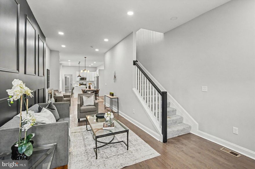 A stunning renovation has transformed this massive, one-of-a-kind end-of-group townhome into the home of your dreams. With an estimated 2,800+ square feet above grade, this is a rare find for the area. From the moment you step inside, you’re welcomed by abundant natural light, high ceilings, recessed lighting, designer fixtures, luxury flooring, new carpet, and a fresh neutral color palette throughout.
The main level offers the open-concept layout, featuring a spacious living room with a custom feature wall, a large dining area, and a beautifully designed kitchen. The kitchen is equipped with ample cabinetry, sleek quartz countertops, a subway tile backsplash, stainless steel appliances, and a stunning waterfall island with breakfast seating for four and pendant lighting.
Just beyond the kitchen, you’ll find a full bath with a walk-in shower, a convenient laundry room, and a cozy family room with an electric fireplace. The spacious primary suite features its own electric fireplace, a large walk-in closet, and a private en suite bath with a double vanity and a beautifully tiled walk-in shower with dual shower heads and a handheld spray.
The lower level is clean and dry, offering utility space and additional storage. Step outside from the side kitchen and enter a rear family room/flex space or additional bedroom with separate access and enjoy easy access to the nearby community green space.
Conveniently located near shopping, restaurants, and major commuter routes, this home offers space, style, and modern living all in one. Property may qualify for special financing programs with down payment and closing cost assistance, subject to buyer eligibility, program terms, and lender approval. Contact for more information.