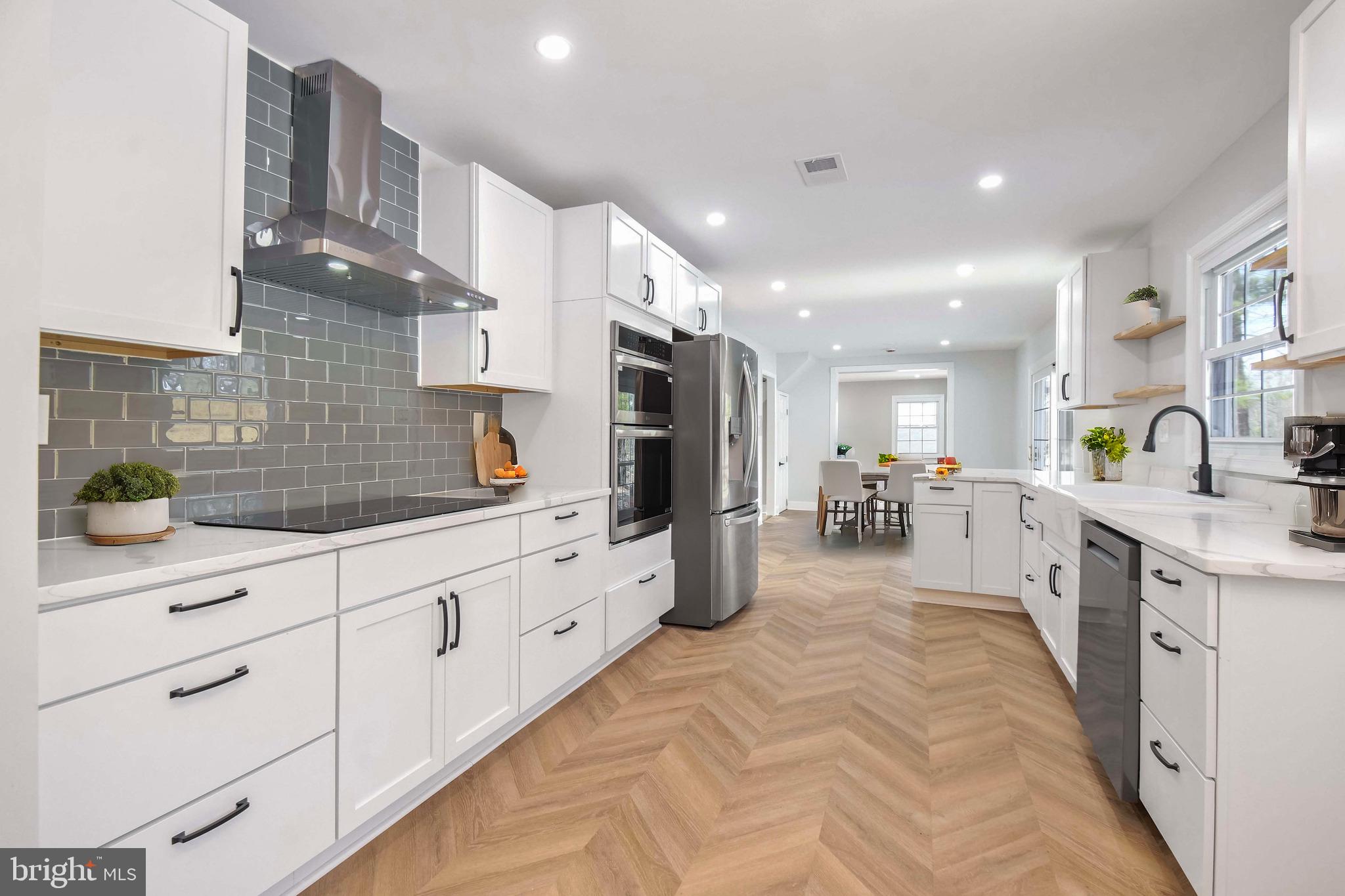 Welcome to this beautifully renovated 4-bedroom, 2.5-bathroom single-family home in the heart of Laurel, MD. Situated on a spacious lot with a large parking garage, this property offers both privacy and convenience. Step inside to discover a modern, open-concept layout featuring top-notch finishes throughout. The kitchen is a chef’s dream, equipped with sleek stainless steel appliances, quartz countertops, and ample storage space. The bright and airy living and dining areas are perfect for entertaining or relaxing with family. The master suite is a true retreat, boasting a spacious layout, generous closet space, and a luxurious en-suite bath. The additional bedrooms are well-sized, offering plenty of room for family, guests, or a home office.
This home has been fully updated with high-quality materials and craftsmanship, making it move-in ready for the next lucky homeowner. Whether you're enjoying the large backyard, parking in the oversized garage, or relaxing inside the updated living spaces, this property checks all the boxes. The community offers Pool as well. Located in a desirable neighborhood with easy access to major roads, shopping, dining, and more, this home is perfect for those seeking both comfort and convenience.