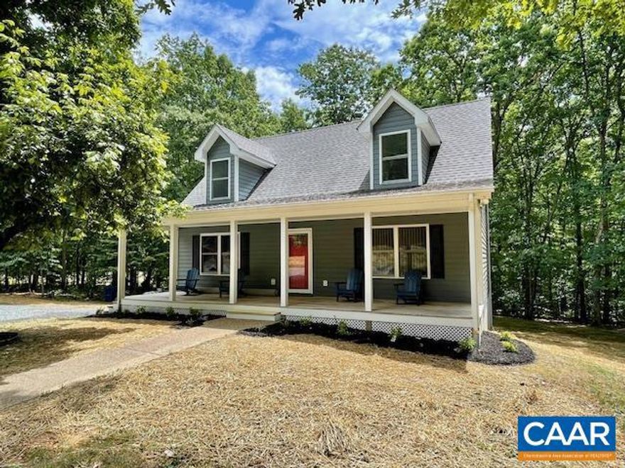 Extremely private 10 acre property with beautifully updated Cape Cod home is MOVE IN READY. Nestled in Southern Albemarle, property offers 1.5 story Cape Cod with finished basement making this home an expansive 2,760 finished square feet of living space. Main floor boasts stunning living room with gleaming hardwood floors, cathedral ceiling, stone floor to ceiling stone gas fireplace and skylight. Living room opens effortlessly to kitchen with breakfast bar and additional space for dining table. Laundry room with ceramic tile flooring has access to huge back deck. The primary en-suite is also on the main floor, and features new carpet, walk in closet, double vanities, freestanding tub and exquisitely tiled shower. 2nd floor features 2 spacious bedrooms, both with walk in closets and built in shelving and easy access to 2nd floor hall bathroom. Finished basement offers a flexible space, and features a full bathroom and well equipped full kitchen! In addition, there is a 960sqft detached garage. Plenty of parking, beautiful home in a quiet, rural area of Albemarle County. Too many highlights and improvements to list here, check out the full list of highlights in docs.,Granite Counter,Fireplace in Living Room