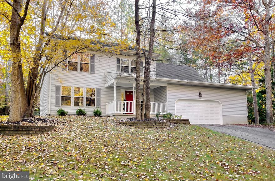 Recently improved price!  Exceptional value in Wildewood's sought after Hickory Nut neighborhood.
Welcome home to this beautifully maintained property that truly shows pride of ownership at every turn. Step inside to find thoughtful updates throughout, including brand-new carpet, gleaming hardwood and porcelain floors, and a spacious, inviting layout perfect for both relaxing and entertaining.

The kitchen is the heart of this home, showcasing rich cherry cabinetry, granite countertops, stainless steel appliances, and under-cabinet lighting that highlights every detail. Whether hosting a dinner or enjoying a quiet meal, this space blends style and function effortlessly.

The cozy family room with a wood-burning fireplace is perfect for chilly evenings, while the home’s natural light and wood blinds create a warm, timeless atmosphere throughout. Upstairs, you’ll find generous storage, including a cedar-lined closet and an additional wardrobe in the primary bedroom, offering both charm and practicality.

And don’t miss the incredible bonus garage and workshop area — complete with a built-in workbench, pegboard tool wall, overhead lighting, cabinet storage, shelving, and even an upper loft for extra storage. Whether you’re a woodworker, hobbyist, or DIY enthusiast, this versatile space is ready for your next project and truly sets this home apart.

Nestled in the sought-after Hickory Nut community of Wildewood, this delightful Colonial-style home combines comfort and convenience. The neighborhood is known for its friendly atmosphere and strong sense of community, with nearby parks, walking trails, and highly regarded schools — making it a wonderful place to call home.