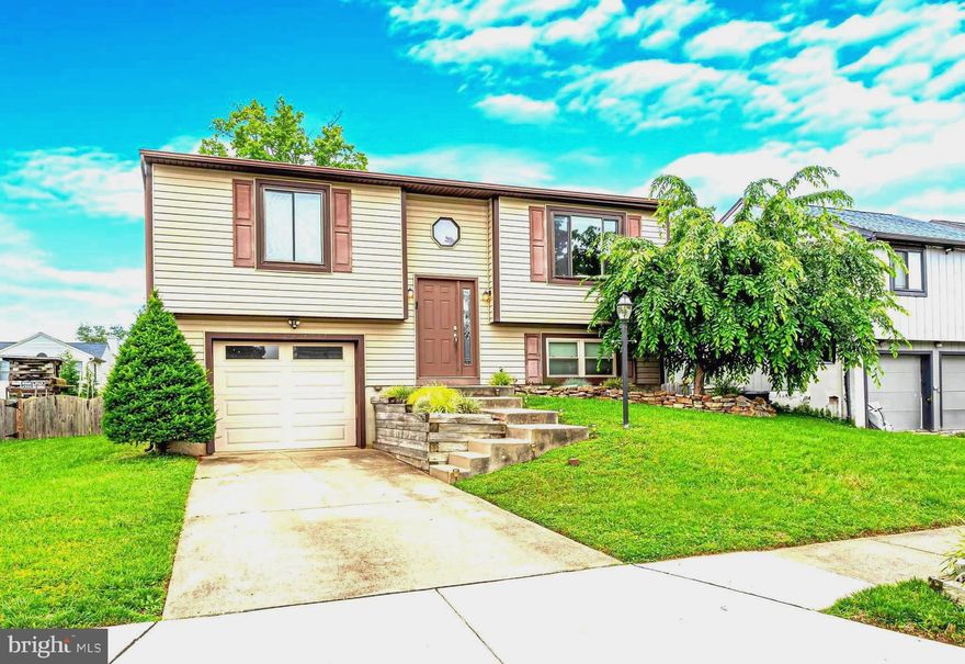 *** MOVE RIGHT IN !!! to this BEAUTIFUL BRIGHT 3BD/1.5 BA SPLIT LEVEL HOME featuring a THEATRE AREA  in BEDROOM 3,  located in DESIRABLE SUE CREEK LANDING with ATTACHED GARAGE, METICULOUS FRONT YARD LANDSCAPING, DRIVEWAY, & DOUBLE-GATED ACCESS to the SPACIOUS FULLY FENCED REAR YARD!!  ____HOME IS LOCATED ONLY A FEW HOUSES AWAY FROM THE PRIVATE COMMUNITY AREA including BOAT RAMP -- HOA is ONLY $150 PER YEAR, and offers a gated COMMON AREA not only with BOAT RAMP, but also FISHING PIER,  PICNIC AREA & MORE -- great for hosting birthday parties & events, or just launching your boat for an afternoon ride ! *** ____The UPPER LEVEL offers VAULTED CEILINGS  *  HARDWOOD FLOORING  *  A BRIGHT WELCOMING LIVING RM w/ GORGEOUS BUILT-IN STURDY FLOATING WOOD  SHELVING   *  HALL COAT CLOSET w/BUILT-INS   *  DINING RM w/ sliding BLINDS-IN-GLASS DOORS to MASSIVE TREX DECK w/STAIRS LEADING DOWN TO REAR YARD   *   KITCHEN w/GRANITE COUNTERS, SPACIOUS CABINETRY, 9-IN DEEP SINK, & WINDOW OVERLOOKING REAR YARD   *   OWNERS BDRM (BDRM 1)  w/8-FT CLOSET w/ ORGANIZER BUILT-INS BEHIND STUNNING DECORATIVE WOOD DOORS   *   2ND BDRM w/7-FT WALK-IN CLOSET w/BUILT-INS   *   SPA-STYLE FULL BATH w/ FROSTED PRIVACY GLASS DOOR, MULTI-DRAWER STORAGE VANITY,  TUB SHOWER w/SOAKING TUB, & SKYLIGHT   ***   ____LOWER LEVEL offers a THEATRE ROOM in SPACIOUS 3RD BDRM complete with SURROUND SOUND,  CEILING PROJECTOR, SCREEN, & BLACKOUT SHADES!   *  WOOD-STYLE CERAMIC TILE FLOORING  *  RECESSED LIGHTING  *   & ATTACHED HALF BATH !  *  LAUNDRY ROOM  *  & UTILITY ROOM w/WASHER, DRYER, & UTILITY SINK  *  ENTRY to FULL GARAGE w/BULT-IN SHELVING!!  *** ____ The MASSIVE TREX DECK & GENEROUS LEVEL YARD w/removable RAISED GARDEN AREA  make for a PERFECT ENTERTAINING SPACE for FRIENDS & FAMILY, or TAKING A MOMENT TO ENJOY A CUP OF SOMETHING DELICIOUS and SOME PERSONAL TIME!! *** ____Located with easy access to 695, and only 3 min drive to TURKEY POINT PARK, only 9 min to ROCKY POINT GOLF COURSE & ROCKY PT PARK & BEACH (with 2 boat ramps, sailing center, pavilions, picnic areas, piers, fishing, playgrounds, restrooms, sand volleyball courts, beaches, swimming & more-- GREAT PLACE FOR FAMILY & FRIENDS!) , THIS IS A WONDERFUL OPPORTUNITY TO MAKE YOUR HOME IN BEAUTIFUL SUE CREEK LANDING !!! **** DON'T MISS THIS !!! ***