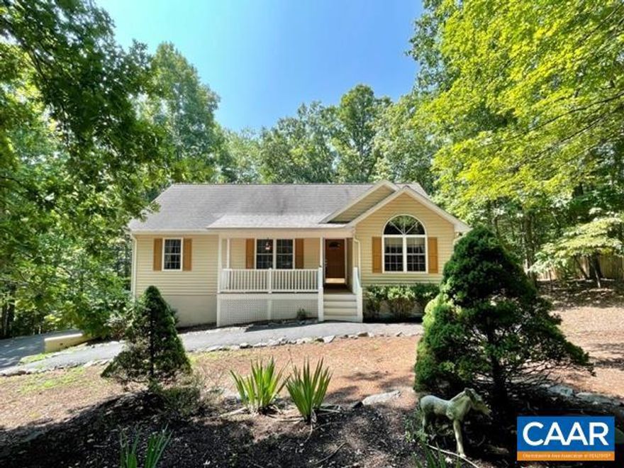 Wonderful home at the Lake. Walk to beach 4 and convenient access to Tufton gate. Wooded lot creates privacy from neighboring properties from the front and back yard. Wonderful split bedroom design, vaulted ceilings, screened porch, paved parking, 2 car garage and finished basement are just a few of the many attributes of this home. Living room features gleaming hardwood floors, gas fireplace, vaulted ceiling and opens to dining/kitchen. Nice breakfast nook just by kitchen, makes a great place to have morning java. Plenty of counter and cabinet space throughout kitchen including a pantry for additional storage. Large master suite with Palladian window, walk in closet and jetted tub. Basement offers great room, finished bath, mud room, laundry room and access to huge garage with workshop bench. Great home with tons of storage! Excellent road frontage!,Wood Cabinets