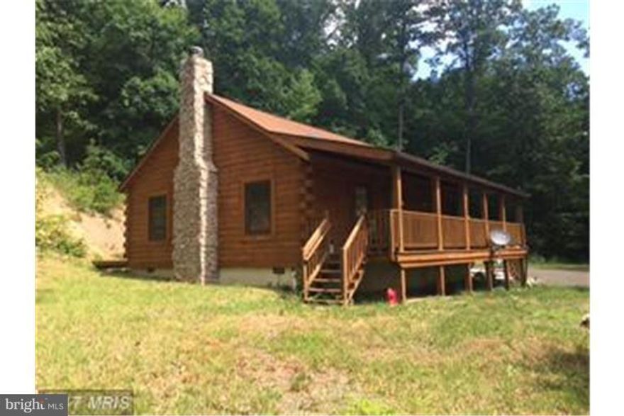 Applications In and being processed.  Adorable, Cozy Log Cabin in the woods!  Front porch with mountain views!  Open living - kitchen - dining with french doors to back deck.  Fireplace for additional heat source.  Master bedroom with bath.  Additional bedroom has washer/dryer hookup. Private.  Rough driveway into the property, requires 4-wheel drive at times.  Accessed off privately maintained road. Borders GW Nat'l Forest, no hunting allowed on property.   Minimum tenant criteria required.