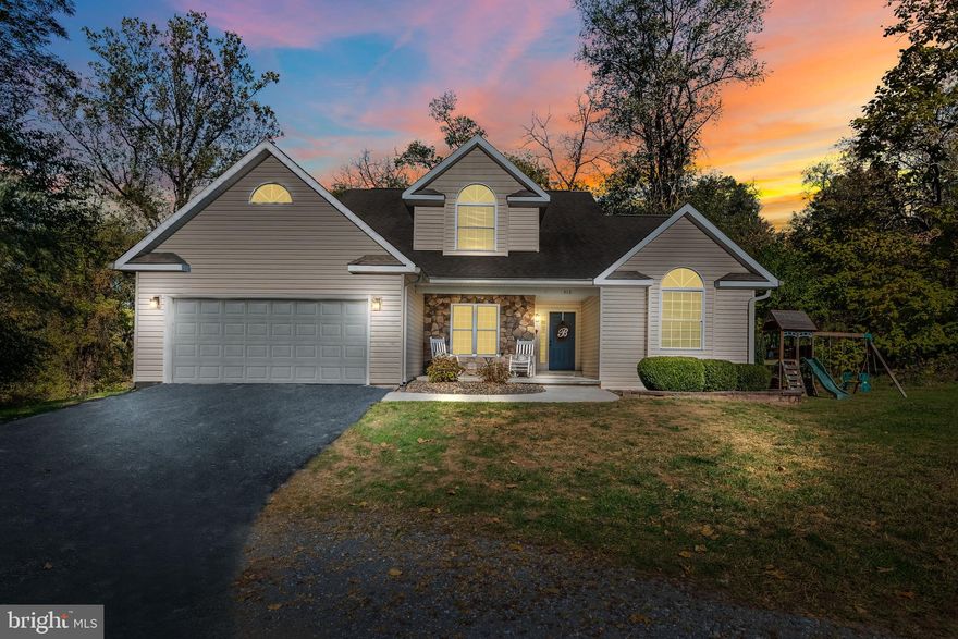 This 4 bedroom, 2.5 bathroom Cape Cod on 2.21 acres is sure to please.   As you enter the home you're welcomed by the high ceiling in the foyer and living room.  The living room also features a wall of windows for natural light and views of the wooded back yard, a gas burning fireplace and recessed lighting.  The living room connects to the open kitchen with stainless steel appliances, peninsula bar and sliding glass door leading to the rear deck.  Main level primary bedroom suite with walk in closet, full bathroom, and cathedral ceiling.  The main level also features a formal dining room, laundry room and access to the attached 2 car garage.   The upstairs has 3 bedrooms and 1 full bathroom.  The HVAC was replaced 2018 and water heater was replaced in 2024.  Long pie sliced mostly wooded 2.21 acres with views toward Reesers Summit.  Schedule your private showing now!