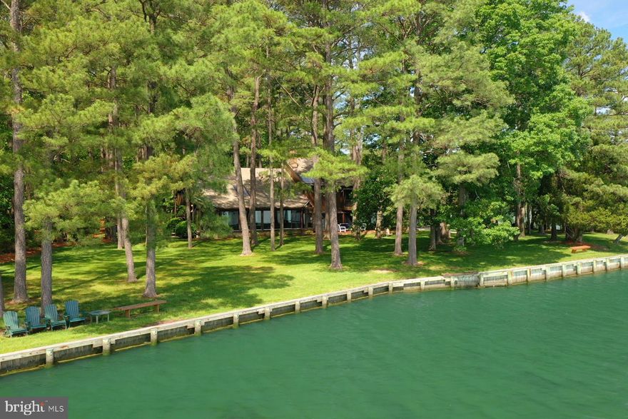 Welcome to this serene 3BR/2BA/2625 sq ft waterfront home perfectly sited on 4.52 private acres in  Bozman, MD. With panoramic views of Broad Creek from nearly every room, this custom-built residence is the perfect blend of rustic charm and modern comfort. The home's chalet-like architecture features vaulted and two-story ceilings, three cozy fireplaces, a generous array of windows and skylights, and an abundance of natural light that highlights its spacious, open layout. A remodeled kitchen anchors the main living space, flowing seamlessly into the bright living and dining areas, all designed to take full advantage of the stunning water views. The flexible floor plan includes a main-level family room that easily converts into a third bedroom. Upstairs, the spacious primary suite features an ensuite bath, private balcony, and tranquil water views. An additional open loft-style bedroom offers space for guests or a home office and also features a private balcony. Enjoy year-round relaxation in the enclosed sunroom or step outside to explore the exterior amenities, featuring an inground heated pool, expansive brick patio, private dock with two slips, and kayak launch - all offering direct access to endless waterfront adventures. Whether you're looking for a full-time residence or a weekend getaway, this one-of-a-kind property delivers luxury, privacy, and the ultimate Eastern Shore lifestyle.  *Property has been approved for additional septic area to accommodate up to 5 bedrooms.*