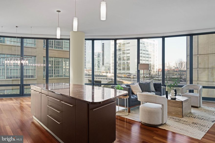 Welcome to 2101 Market Street, Unit 302 – a stunning, spacious, and thoughtfully upgraded north-facing residence in the prestigious Murano condominium. This beautifully maintained two-bedroom, two-bath unit offers 1,470 square feet of sophisticated city living, complete with 11-foot ceilings, gleaming Cherrywood floors in the main living area, and hardwood floors in both bedrooms. Modern luxury meets functionality with solar and electronic shades, upgraded stainless steel appliances, and a seamless open-concept layout designed for comfort and entertaining. The expansive windows flood the home with natural light while offering peaceful city views. The generous primary suite includes ample closet space and a well-appointed full bath, with the second bedroom and bath offering ideal flexibility for guests, a home office, or den. This residence also includes dedicated parking and additional storage, making it a rare and valuable find in one of Philadelphia’s most desirable high-rise buildings. Residents enjoy access to top-tier amenities including a 24-hour concierge, fitness center, indoor pool, and a sleek resident lounge.