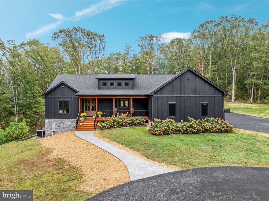 24 hours notice to show - you can schedule now for friday!      
No drive bys! 

Upscale Custom-Built Craftsman on 10.5 Acres

Welcome to this stunning one-level craftsman-style home, thoughtfully designed and built as the builder’s personal residence. Boasting over 3,000 finished square feet, this property combines modern efficiency, timeless craftsmanship, and exceptional outdoor living—all on a private 10.5-acre setting ideal for wildlife lovers and hunters.

Interior Features

Vaulted ceilings in the living, dining, and kitchen with a striking live shed dormer that floods the home with natural light.

9’ walls on both the main level and basement for a spacious, open feel.

Gourmet kitchen featuring Café and ZLINE appliances, pot filler, wine chiller, built-in microwave, and level 5 leathered granite countertops (including an oversized island with level 5 quartz counters)

Custom white oak open shelving and mantle, crafted from wood harvested on the property.

Shiplap accent walls, upgraded lighting package, and under-cabinet lighting.

Great room with a gas fireplace, framed by real stone veneer and a handcrafted mantle (wood is from the property) 

Dining area designed to accommodate large gatherings with feature lighting.

Primary ensuite featues a beautiful custom tile shower; free standing soaker tub; double vanity with quartz counters; lots of natural light; a huge walk in closet

4 ½” white oak hardwood flooring throughout the main level, with black and white natural stone in the mudroom, half bath, and laundry.

2 laundry hookups—one on the main level and one in the lower level.

Rough-in for a future full bath in the basement, plus walk-out access to a patio.

Energy Efficiency & Systems

400-amp service with backup generator disconnect.

Energy-efficient with spray insulation in walls and R-48 in ceilings, resulting in an average electric bill of just $220/month.

Black Andersen casement/fixed windows with craftsman grid pattern, tinted for comfort, exceeding Energy Star requirements.

ThermaTru fiberglass exterior doors and a double 8’ craftsman-style entry door.

This home is a dream for entertaining and enjoying the outdoors:

30’x12’ covered back porch with recessed lighting, wired for TV.

26’x26’ stamped concrete patio with real stone wood-burning fireplace and gas line for your grill.

30’x6’ covered front porch with recessed lighting and electrical outlets.

45’x4’ stamped concrete sidewalk to the front entry.

10’x6’ paver patio at the basement walkout.

LP board & batten siding (black), cedar posts, composite decking, real stone veneer accents, and 30-year architectural shingles.

Side-loading 2-car garage plus gravel parking area; upper portion of the driveway and parking area paved.

Property Highlights

10.5 acres of privacy—perfect for hunting, wildlife watching, or simply enjoying your own retreat.

Shared driveway entrance with a gravel drive.

Craftsman design details throughout, blending modern efficiency with rustic charm.

This property offers the rare opportunity to own a builder’s showcase home, thoughtfully crafted with top-of-the-line finishes, energy efficiency, and outdoor living spaces designed for year-round enjoyment.