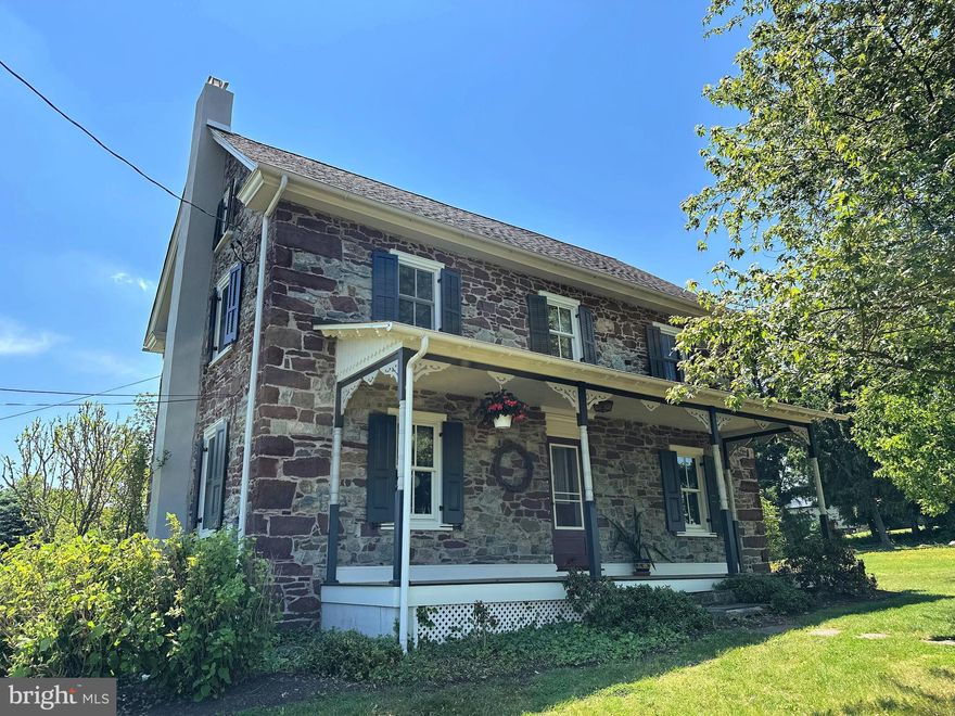 Lovely stone farmhouse with a framed addition, lovingly maintained by the owners for 36 years. The updated kitchen features quartz counter tops and opens to an eat-in area. A spacious formal dining room is perfect for family gatherings. The addition offers an inviting foyer with exposed stone, a powder room, laundry, and a bright living room with abundant windows, a stone fireplace (stone from the original home), and views of the property. Upstairs you'll find a primary suite with bath and walk-in closet, three additional bedrooms, and a sunny open area currently used as an office. A third-floor bonus room provides flexible space for a game room, craft room, or storage.  There is a large two-level rear deck ideal for entertaining and relaxing beside the small pond and waterfall, with views of horse pastures. Across the road are 42 acres of township-preserved open space. Close to Spring Mountain Adventures, Montgomery County trails, and the township park with walking trails, sports fields, and Frisbee golf. Convenient access to multiple travel routes. With so many features and location perks, this property won’t last long.