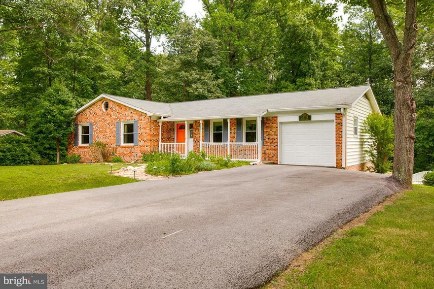 New price! Peace & serenity on nearly 1 acre. 3 bedroom, 2.5 bathroom rambler with finished basement. Spacious kitchen features tile, newer appliances & new door. Newer roof w/ 25 year warranty on shingles. Walk-out basement includes a rec room, potential 4th bedroom, custom bar & pellet stove. Deck & patio overlooking private backyard w/ pool. HOA $28/year includes boat ramp & beach privileges.