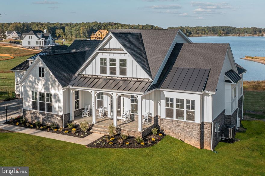 To Be Built! Spectacular Waterfront Home for Sale! 400 ft of Shoreline!

Discover unparalleled water views on your own lakefront point lot! This exquisite Robey model by Evergreene Homes is situated in the new Compass Cove neighborhood on the private side of Lake Anna. This magnificent home will offer approximately 6,000 finished sq ft on 1.134 acres, featuring 4 bedrooms and 4 1/2 bathrooms with numerous upgrades throughout, a 3-car side-load garage, and low maintenance Hardi-Plank siding.

Upon entering, you’ll be welcomed by an open floor plan with 10 ft ceilings, a coffered ceiling, and a cozy fireplace in the family room. The kitchen is equipped with upgraded stainless steel appliances, tall cabinets with partial glass fronts, and under-cabinet lighting. 

The master suite, located on the right side of the home, serves as a private wing. This spacious master bedroom opens to a screened-in porch and includes a bathroom with a tiled shower and freestanding tub, as well as an expansive closet that feels like an additional room. 

The first floor also features a study/office and a large laundry room with built-in storage and coat racks. The upper level includes a loft and 2 bedrooms, each with its own full bathroom and stunning views of the lake as well. 

The finished basement offers a vast recreation room with rough-in for a bar/kitchen area, a 4th bedroom, and another full bathroom. There is additional unfinished space for media and fitness room expansion. High-speed internet is available!  

Additionally, there is an option to build a boat dock for an additional cost on over 400 ft of deep water shoreline. 

** PHOTOS ARE OF THE SAME FLOOR PLAN (ROBEY), SELECTIONS MAY BE DIFFERENT. 

10-year warranty included with the purchase of the home.