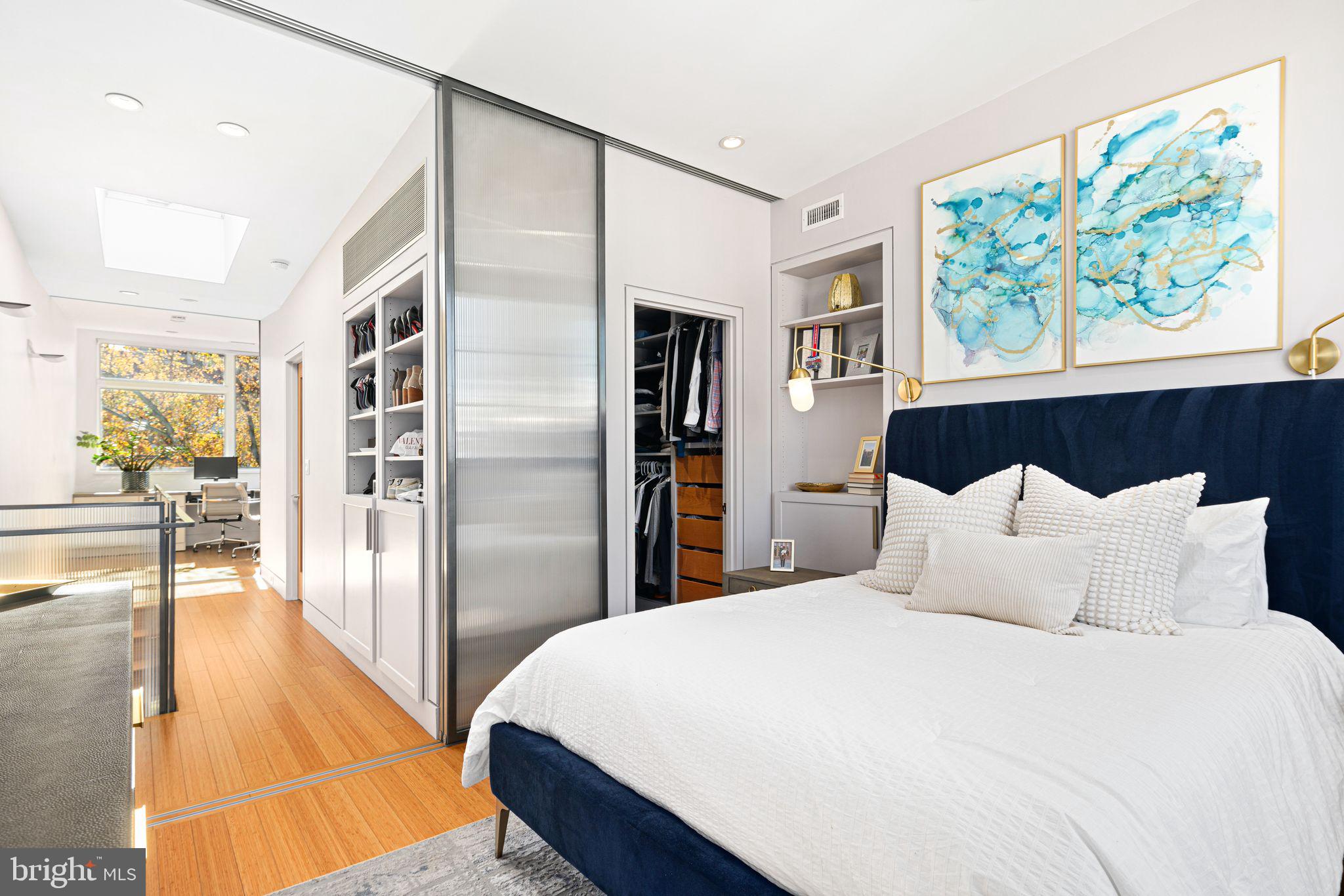 Don't miss this incredible opportunity to live in a stunning home in the heart of Philadelphia's favorite neighborhood! Designed by the award-winning architects Rasmussen/Su and featured in Philadelphia Style magazine, this stylish home is a must-see and located on one of the neighborhood's most charming blocks, beautifully lit by string lights! Through the classic vestibule entrance is the inviting living room with an original mantel and custom built-in shelves seamlessly flowing into the formal dining room. Gleaming hardwood floors, detailed crown molding, and elegant pocket doors add to the overall aesthetic.
The spacious chef's kitchen is a highlight, featuring a 36" oven, a sleek floating hood, a brand new LG dishwasher, and an abundance of storage. Bring the outdoors in with the extra wide rear door and screen overlooking the fully decked serene garden and the Museum of Art’s Perelman building.
Upstairs, the second floor offers two generous bedrooms, each thoughtfully customized with expansive California Closets to maximize storage and organization. The elegant hall bath features heated floors, a custom glass shower door, and a Bosch laundry closet. Prepare to be wowed by the third-floor addition! Designed with high ceilings, a skylight, and large windows that flood the space with natural light, this primary suite is a stunner!. The rear bedroom, currently being used as a stylish home office, includes a custom-built California Closet desk and modern translucent sliding doors for privacy. The spacious master bedroom is a retreat of its own, with a walk-in closet, built-in bookcases in the hallway, and a luxurious marble-tiled bathroom with a rain shower and heated floors. The finished basement offers plenty of possibilities, whether you're looking for a cozy playroom, media room, or extra living space. It also includes an updated half bath, additional storage, and an additional full size Speed Queen washer/ dryer. This one of a kind home is surrounded by local amenities like coffee shops, bars and restaurants, Whole Foods, community garden, weekly Farmers Market, Kelly Drive and the river, Fairmount Park, and world renowned museums. With easy access to bus routes, getting around the city is a breeze! Fairmount offers a unique opportunity to live in a thriving community with plentiful green space in the heart of the city.