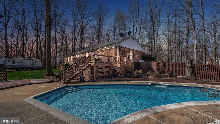 Welcome home to your entertaining oasis! Featuring 2 acres of partially wooded property, an in-ground pool with diving board, multi-level deck and pool house, partially fenced back yard and high voltage exterior outlet for your RV or similar and NO HOA regulations, so your options are virtually limitless.  Inside the beautiful all-brick exterior of this meticulously maintained home, you'll find a fully renovated kitchen with new soft close cabinets, butcher block counters, all stainless appliances, an eat-at island, spacious pantry and solid wood flooring. Plus, updated bathrooms with new flooring, toilets, vanities, lighting and mirrors, a walk out basement with built-in bar, both family room and living room with gas fireplaces and nearly 3000 square feet of total living space. Whole home GENERAC generator guarantees you will never be without power. Easy access to I-17 puts all of Northern Virginia within your reach.