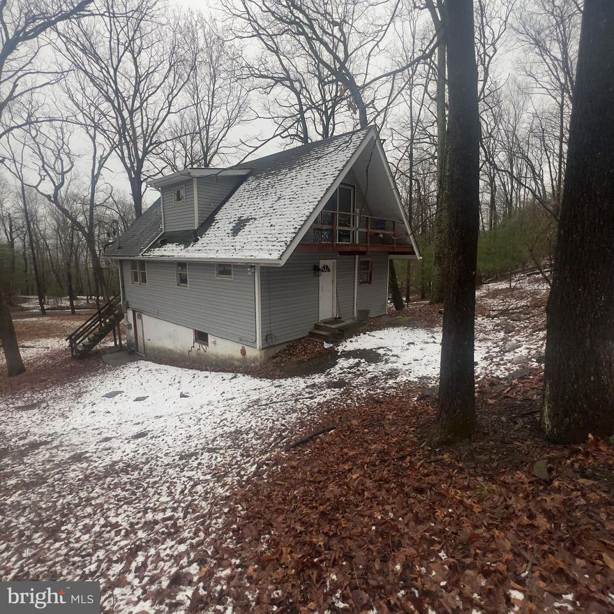 HIGHEST AND BEST OFFERS DUE SUNDAY, APRIL 20 @ 8PM. Set on over an acre of serene, wooded land, this charming 3-bedroom, 2-bath Chalet comes with a bonus 1-bedroom, 1-bath ADU—perfect for guests, rental income, or multi-generational living. Located near the stunning Delaware Water Gap, this property features low HOA fees and taxes, a 2-car garage, and tons of untapped potential. Ideal for buy-and-hold investors, fix-and-flip opportunities, vacation home seekers, or owner-occupants looking to build sweat equity. Make this versatile property your custom mountain retreat—rare value in a highly desirable Pocono setting!