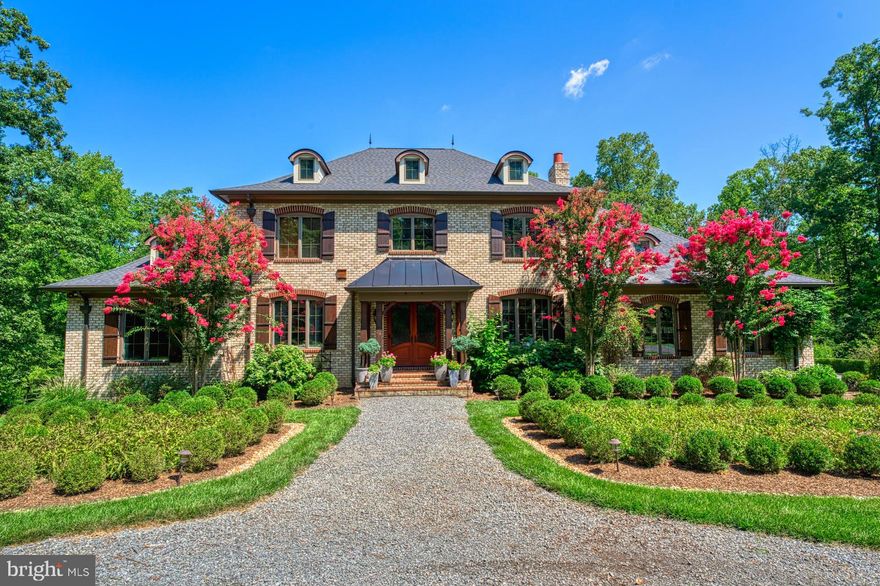 Have you always dreamed of living in a French Country Manor?  Look no further, your dream has come true!  This gorgeous 6 Bedroom, 5.5 Bathroom Chateau sits on 11.5 acres and is in one of the most sought-after Leesburg locations. **Enter the glass, iron rod, double-front doors and be welcomed into a 12' elegant entry with tall wainscotting panels, elaborate crown molding and beautiful hand-scraped hardwood throughout.  Flanking the entry are the library and formal dining rooms, both with beautiful, coffered ceilings, floor to ceiling black bookcases, and plenty of South Facing Sunlight.  Entertain in the most artful way; the dining room offers a grand propane fireplace with a dramatic mantle and a tasteful, crystal chandelier.  Custom Wood Blinds with give-away, child-proof pull strings adorn the windows. **Main Level Primary Bedroom has Double doors overlooking the beautifully landscaped backyard and Pool, Marble Bathroom, and huge closet! **All Bathrooms boast Kohler Archer Toilets and Sinks. **The Kitchen is a Gourmet's dream!  As you enter, you'll stand in awe of the massive work of Art, that is the Hood over the Viking 6 burner gas cooktop and the dramatic wood beams leading to the family room. **High End features include but are not limited to, Bosch dual dishwashers, 48" Thermador side-by-side refrigerator, gorgeous custom "Wood-Made Brand” cabinets with soft close mechanisms, GE Profile double oven with an Advantium top oven, butcher block island with loads of cabinet space and small prep sink, ambient, task and decorative lighting.  Enjoy cozy evenings in front of either of the 2 Stone Wood Burning Fireplaces. and with 11 acres of hickory and oak trees, you will never be cold in the winter!**2yrs of pre-cut firewood at your disposal.**Climb the beautiful hardwood stairs with wrought iron balusters to the Upper Level that boasts 4 additional Bedrooms and 3 Full Baths + Large Loft space, including 2 Ensuites, either could serve as an upstairs Primary (think Multi-Generational living!!**Lower level is an entertainers dream including full wet bar with lots of cabinet storage space and sunken Media Room.  Imagine the parties, Friends and family playing Pool while enjoying a Movie on the Projection Screen complete with 9.2 surround sound, theatre quality sound system including not one, but two subwoofers that truly rivals any commercial theater experience!! Not to be outdone by the entertainment space, the Lower Level additionally offers a cozy seating area with wood burning fireplace, walk out to pool area, a 6th Bedroom with wall of large beautiful windows overlooking the Pool area, gym with mirrored walls and padded rubber floors, 6th Bathroom with outdoor access to Pool, Loads of Storage, and workshop/flex space with outdoor Pool access.** Heading outside, the GORGEOUS Pool is equipped with auto cover, heater, and a BADU swimjet system, which allows you to swim laps IN PLACE!! Backyard is Beautifully hardscaped and landscaped, presenting with gorgeous, tiered gardens and professionally built firepit**SMORES anyone?? **Enjoyment of the property has been made easy with a great trail system throughout the 11.5 acres. The multiple trails cleared throughout the property are wide enough to ride an ATV, or just go for peaceful walks and enjoy the beautiful nature accented with large, beautiful hardwoods such as Red Oak, White Oak, Hickory, and American Beech. Explore the meandering south fork of the Sycolin Creek that crosses through the northern part of the property. Enjoy the wild turkeys, the foxes, the squirrels, and the wide variety of birds, including owls that make their home here. **This Exceptional estate is in the most convenient location in Leesburg, located a quick 15 mins to historic downtown, 10mins to Dulles Toll Rd and Rt. 7.  This is the property you have been waiting for!**Entertainment Center in Family Room Conveys**Sellers require Rent-Back through the end of December**Additional Features in Docs