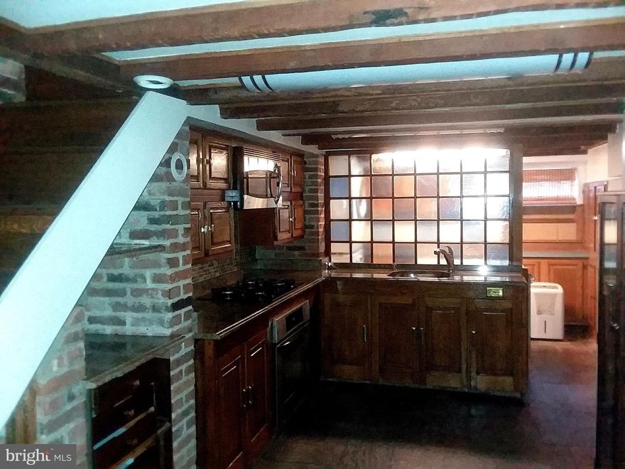 Location Location Location, Minutes away from Camden Station, the Inner Harbor, and Downtown.  A block or so away from the Newly Renovated Lexington Market, Close to the Art District and Baltimore's up coming entertainment Hub. 4 level End Unit Townhouse,  Featuring Universal charm, Exposed Brick, Wood Floors, Granite Countertops, Stainless Steel appliances and other Custom Features. Descriptive Unique Out door Living Space.  Move in Ready.