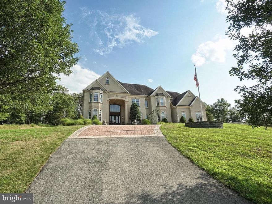 When only the best will do...Amazing opportunity to own the timeless masterpiece  situated on 10.75 private acres. Own your very own private resort in this super luxurious home with a stunning indoor salt water pool and hot tub with fountains and so much more. Over 12000 square feet of elegant living space with great attention to detail all throughout.  Features include: custom moldings, marble, tile, cabinetry, custom bar, hardwood floors throughout, custom vanities & lighting, large deck, soaring ceilings, wrought iron railings and so much more.  This home is and entertainer's dream. The virtual tour and professional photography are a must see.  Radiant heated floors including garage. Custom stone work, roof with 50 year shingles and more.