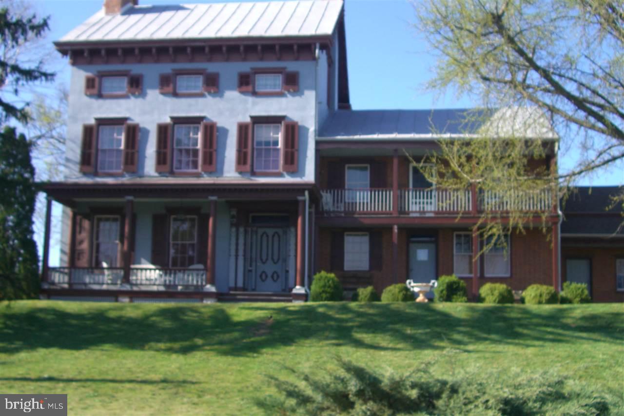 This lovely, well maintained 5 bedroom, 3.5 bath, federal home, circa 1890, has all the conveniences for modern living. A stunning gourmet kitchen with upscale cabinetry, countertops, and appliances opens into a beautiful sunroom with a 2-sided gas fireplace. There is an in-law suite with kitchenette, laundry and full bath. The remodeled bank barn could be used for a studio workshop, vehicle or equipment storage, or many other possibilities. New furnace with multi-zones and 400 amp electric service.