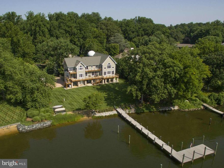 This stunning custom waterfront home is situated on a private 1.36AC home site overlooking Crab Creek/South River. It features a huge master suite w/ luxury bath, custom timber frame great room, pool house, barn & observatory!  Waterfront decks on both upper levels are perfect for enjoying the sunrise and great for entertaining. Enjoy the private beach and pier w/ deep protected water.