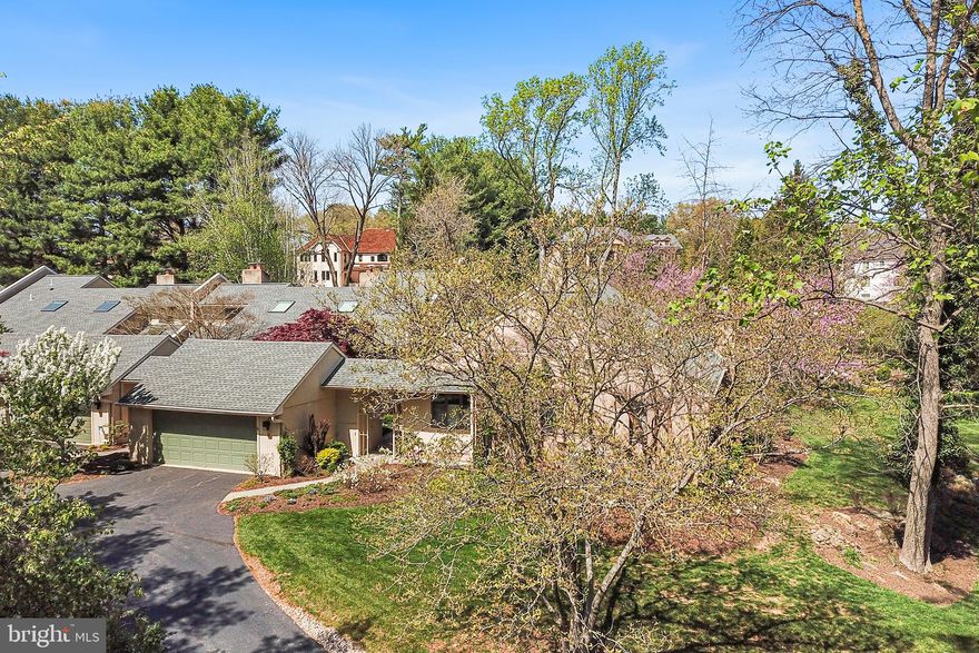 Toft Woods is a secret gem of a community tucked away in a serene, secluded setting. 23 Toft Woods Way is a beautifully maintained and thoughtfully updated home that blends nature, comfort, and style. Surrounded by lush forest views from every window, this property offers a true indoor/outdoor lifestyle while providing all the modern conveniences you could ask for.

Park in the oversized garage and walk through your own private courtyard to the covered front porch entrance of the home.  Here you can find an integrated potting shed and corral for wastebins.  The outdoor courtyard space is secluded and highlighted with various plantings to create a warm welcome home.

Inside, you’ll find rich hardwood mahogany floors throughout the main living areas that flow seamlessly into one another lending warmth and elegance to the space. The vaulted ceiling in the family room creates a grand, airy atmosphere, perfect for both relaxing evenings and entertaining guests.  This open space includes a gas fireplace focal point and oversized windows that let in tons of natural light. From here you can enter the large dining room with plenty of space to host all your guests.

The heart of the home—a clean, open-concept kitchen—is bathed in natural light thanks to overhead skylights and designed for functionality and ease. With access to the outdoors from here you can spot wildlife or just enjoy the natural beauty of your surroundings. 

Another inviting living space is the den with two story built in bookshelves accessed by a ladder and another fireplace.  This room is ideal for immersing yourself in a new book and cup of tea.  Additionally, an open staircase leads to a bright loft that overlooks the living room and includes built in shelving and desk space.  

A hallway leads to the primary suite with slider door access to the outside.  The fully renovated en-suite bathroom includes a walk-in closet outfitted with custom organization, a glass door shower and separate vanity and linen storage. This bathroom includes the luxury of radiant floor heating, adding an extra touch of comfort.  A second updated bedroom and hall bathroom also have access to this hall as well as a convenient laundry closet with washer and dryer. 

Downstairs, an expansive finished basement with a half bath and generous storage space offers endless possibilities.  The current owners have a wine cellar area, a pool table, a living space with wood burning stove and an additional finished space — whether you envision a home gym, guest bedroom, home office or additional living area.

Outside features a low-maintenance Trex decking, recently replaced for long-lasting durability, and perfect for taking in the peaceful surroundings. The HOA community offers services like snow removal, common area maintenance, trash services and tree maintenance.

Located close to everything Media has to offer like Rose Tree Park free summer concert series, Media Borough events like holiday parades and dining under the stars as well as shops and restaurants.  Close to Route 1 for connection to all major roadways.

This is more than just a home—it’s a lifestyle of tranquility and modern living, all wrapped in the beauty of nature.