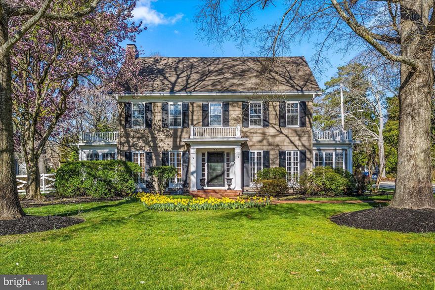 A beautiful .48 acre setting and a classic center hall design set the tone for gracious living at this beautiful 2906 sq. ft. residence minutes from Salisbury University, Tidal Health and Downtown Salisbury.  Hands down one of the most striking homes on Camden Avenue, its curb appeal is unmatched, and its interior is warm and welcoming. Features include hardwood flooring throughout and a spacious living room w/ fireplace, formal dining room, sunroom, powder room, a spacious kitchen that would delight any cook w/ stainless appliances, breakfast room/den, and a butler's pantry/bar area on the 1st floor.  The upstairs features a primary bedroom w/ private bath and 2 closets, 3 additional bedrooms, a sitting room, office/playroom and hall bath. The exterior offers a Koi pond, very private paver patio w/ pergola, fenced back yard, in-ground irrigation, and 2-car detached garage w/ electric opener.  2024 updates include a new heat pump and landscape up-lighting. 2025 updates include resealing of flats roofs and replacement of roof shingles on the house and garage (complete tear off of old shingles and installation of new to take place prior to settlement).