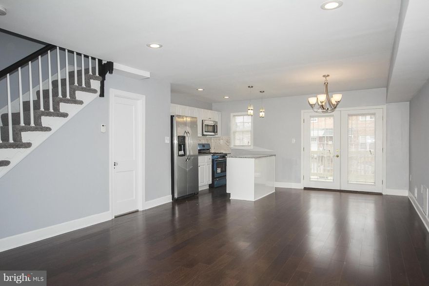 **Price reduction**Great rehab in stable community. Inviting main level with an open floor plan. Wood floors, granite counters, french doors leading to the rear deck. Finished lower level with plenty of space to entertain and a full bath. Carpeted upper level with 3 bedrooms, and beautiful full bath.