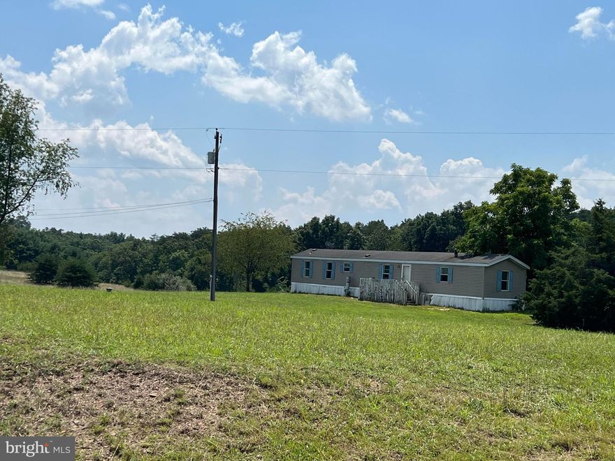 Two UNRESTRICTED Lots are being sold. One lot is 3.33 acres and the other is 3.13 acres . There is two single wide trailer's on each lot. They are not on permeant foundation and one could be used for storage. The other might be able to be fixed, but neither are in great condition. The listing is really for land only with the bonus of two trailers. There are 2  private wells, 2 private septic's and 2 private addresses. 
You are 6.9 miles from downtown Hancock, MD. Where you can enjoy the parks, C and O Canal and local shops. Only minutes away of I-70. Lots have a lot of potential, You could build your own house, fix up the existing dwelling and rent it, or do both.
Will have ariel photo's posted soon.