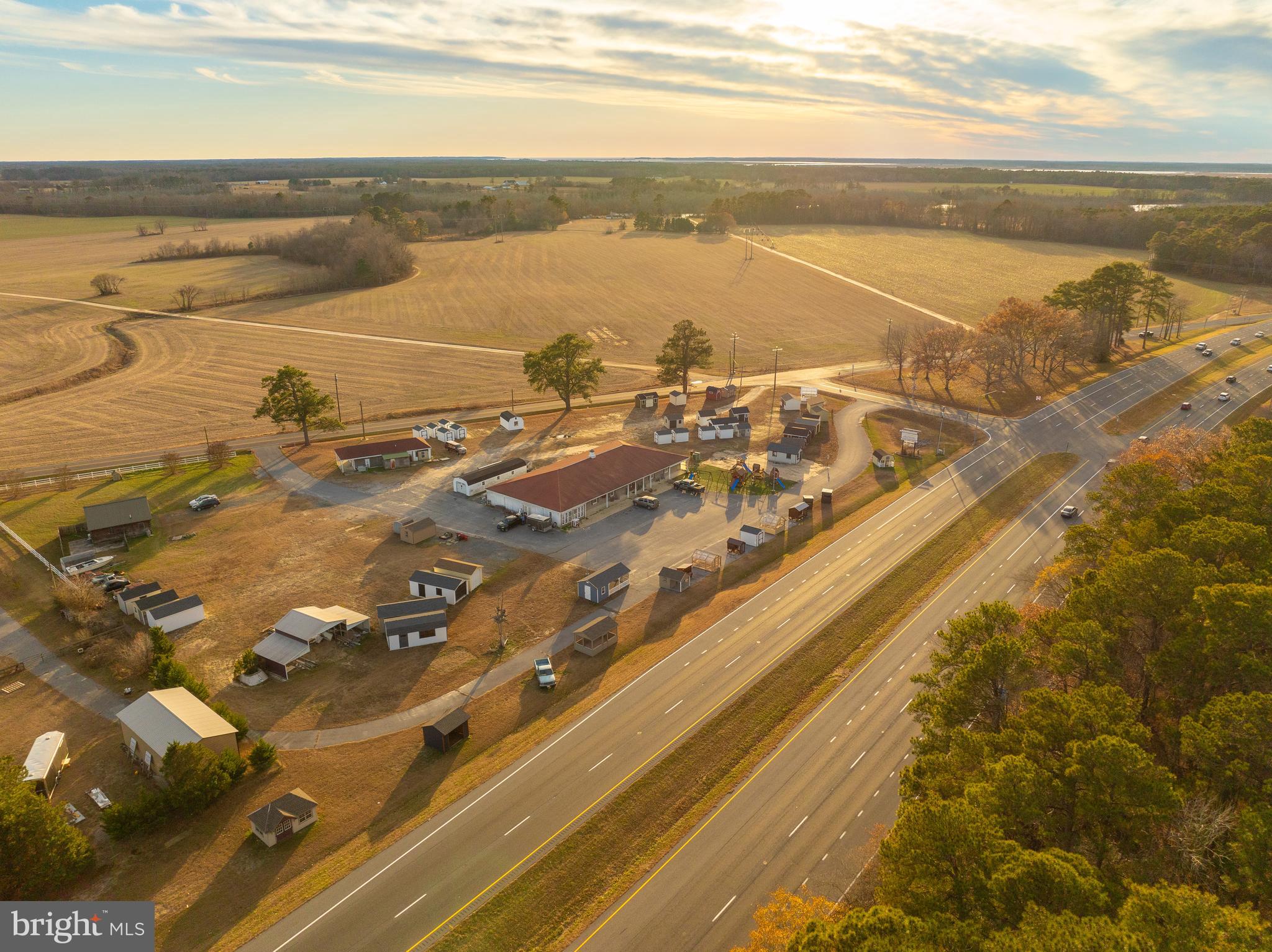 Strategically located property on US Route 50/Ocean Gateway and E. Main Street Extended, Mardela Springs, MD. 7,130 sq.ft. retail store or office building, 1,500 sq.ft. add'l retail building and 900 sq.ft. single family home (currently leased). 4.20 acres total with 2 access points. Large paved parking area with great signage and visibility. Located adjacent to a crossover for westbound access.
Owner will consider leasing the 7,130 sq.ft. building with 1.5 acres for $6,000 per month.