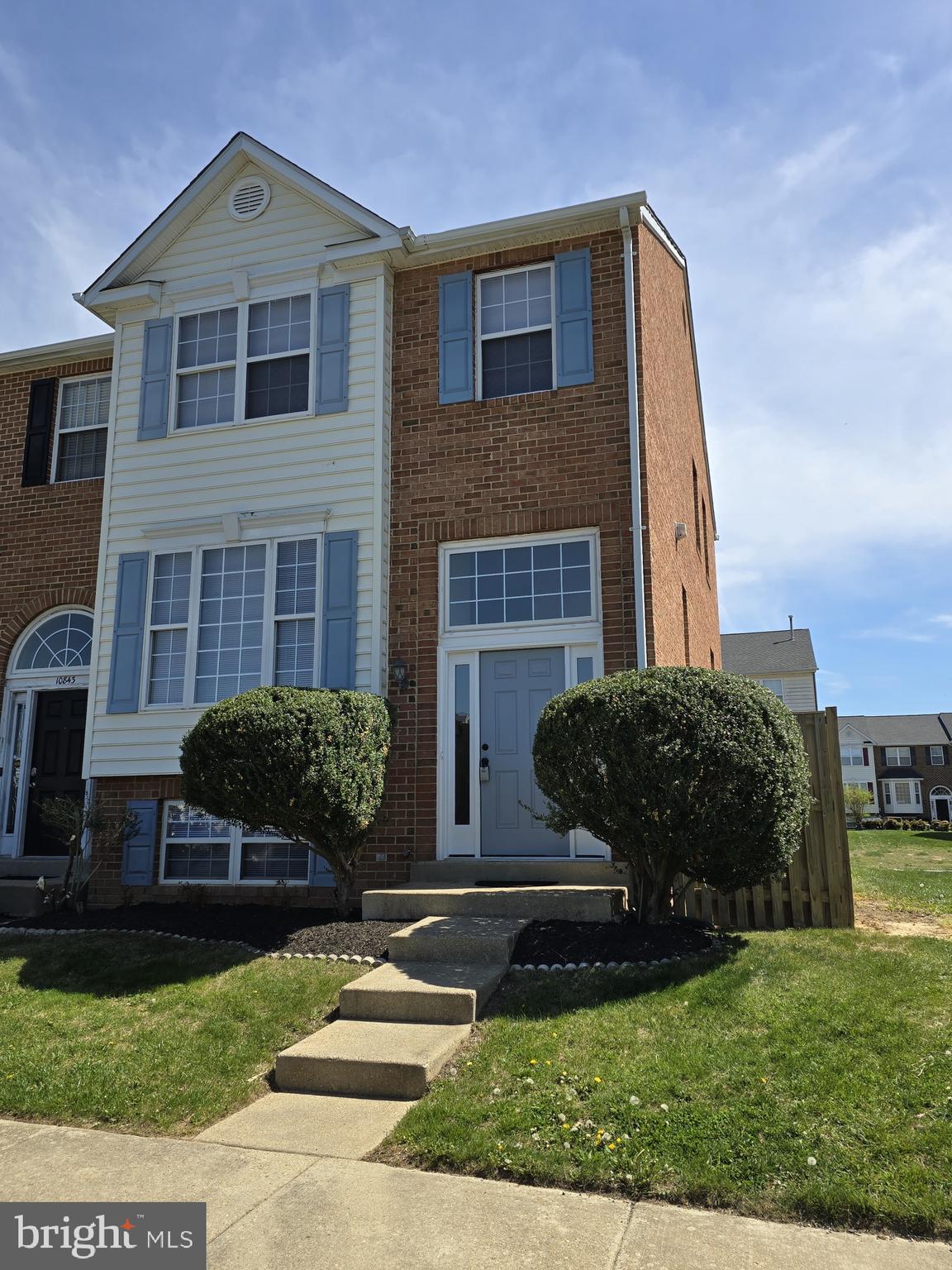 Welcome to your dream home! This beautifully updated 3-level end-unit brick-front and side townhome offering 4 bedrooms, 3.5 bathrooms, and a fully finished walk-out basement with private suite. This move-in ready home features a fresh interior with new paint throughout, brand-new carpet, and new vinyl flooring in the kitchen and bathrooms. The main level offers a spacious living room with a gas fireplace, a dining area, and an updated kitchen equipped with new black appliances including a stove, dishwasher, and microwave. The refrigerator is just one year old. The kitchen also has an eat-in area. Upstairs, you'll find generously sized bedrooms with new light fixtures and ceiling fans. The primary suite has a vaulted ceiling and includes a walk in closet. The ensuite bathroom contains a soaker tub and stand up shower. The lower level is perfect for guests or an in-law suite with a bedroom, full bath, and a large den with a gas fireplace and wet bar. The walk-out basement leads to a fenced backyard—ideal for relaxing or entertaining. Additional updates include a new front door, new basement sliding glass door a brand-new A/C system for year-round comfort. The kitchen slider will be replaced. Conveniently located near shopping, dining, and entertainment options, this townhouse offers the perfect blend of suburban tranquility and urban convenience. Plus, easy access to major highways makes commuting a breeze, ensuring that you're never far from the action. Don't miss your chance to make this stunning townhouse your own! Schedule a showing today.
