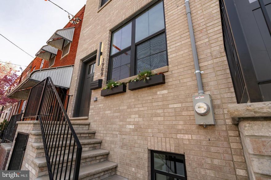 Magnificent  Passyunk Square new town house Three story town house. 10 year tax abatement.
Custom brick facade. Full finished basement with high ceilings rear bedroom with custom bathroom. Custom 6 inch Dorchester engineered hardwood flooring through out this entire home.
First floor spacious  First floor boast a custom living room and kitchen with abundant custom cabinetry, quartz counter tops, and rear living room entrance with sliding doors to nice size private yard. 
Second floor includes a convenient laundry room with washer & dryer. 9 foot + ceilings, Rear bedroom large closet, custom tile bathroom, Large Front bedroom with custom large bathroom custom porcelain tile bathroom with beautiful walk in shower frameless glass shower doors. Third floor primary suite impresses with 9 foot + ceilings, custom large porcelain tiles, spectacular custom shower, supper walk-in closets. Hallway features wet bar for walk up to large fiberglass roof deck amazing skylines.
Steps to Passyunk Square, walking distance to Restaurants, Shopping, super markets, Center city, Philly sports complex. A rare opportunity thoughtfully designed, luxury townhouse on one of Philadelphia's most desirable neighborhoods.