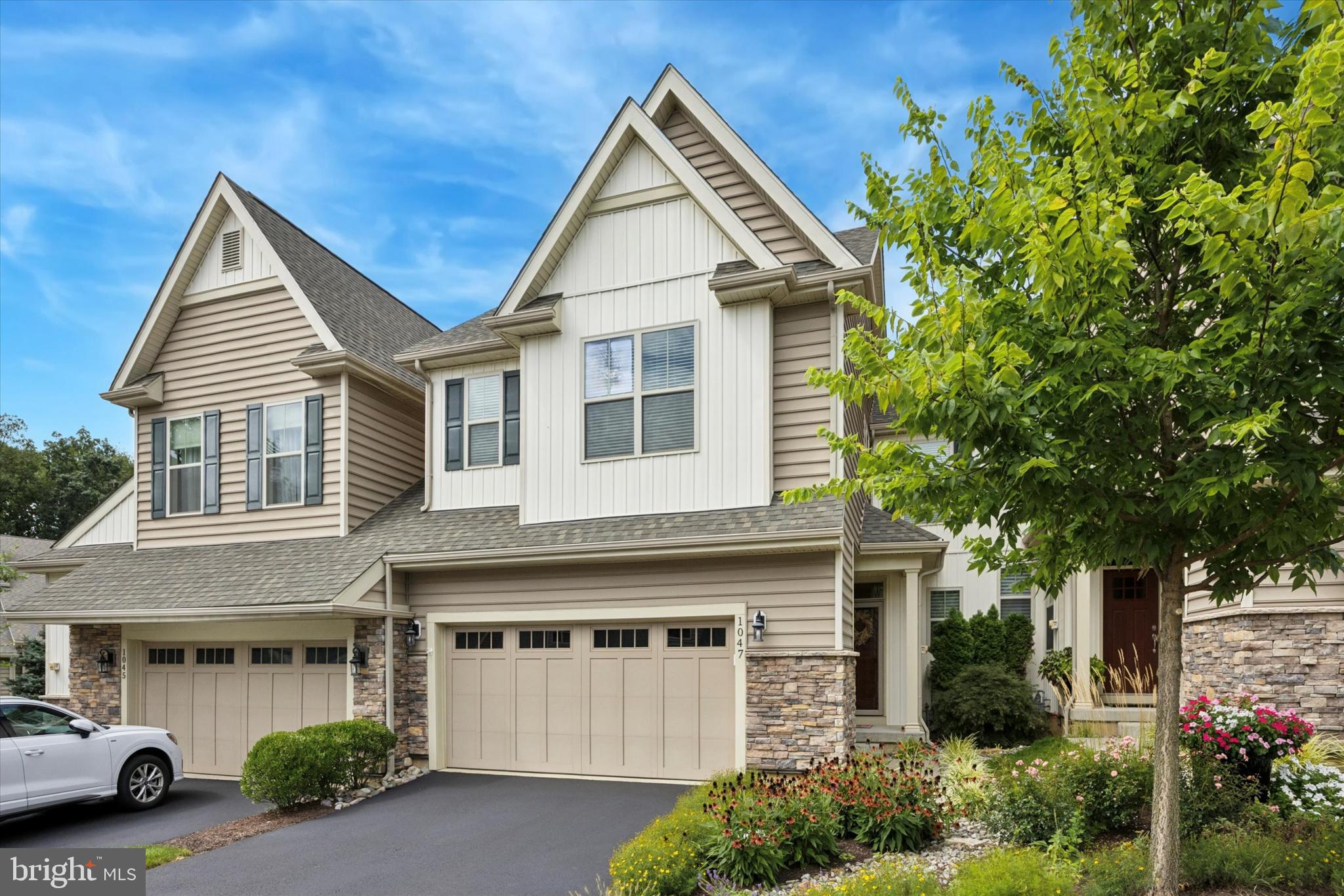 By Appointment Only – Welcome Home!
Nestled in the sought-after Stonehouse community by Bentley Homes—an intimate enclave of just 38 luxury carriage homes—this residence blends the elegance of a single-family home with the ease of low-maintenance living. All within a mile of vibrant downtown Kennett Square.
Step inside and you’ll immediately notice the warmth and light. Gleaming hardwood floors flow through the main level, guiding you from the foyer to the heart of the home: a chef’s kitchen with quartz counters, oversized island, stainless steel appliances, gas cooktop, chimney-style vented hood, and built-in oven and microwave. The open floor plan continues to the dining area and spacious living room with a cozy gas fireplace built in bookcases and access to a trek deck with serene views.
The first-floor primary suite is a retreat of its own, featuring a tray ceiling, two walk-in closets with organizers, and a spa-like bath with double vanity and tile shower. A powder room, laundry, and direct garage access add everyday convenience.
Upstairs, you’ll find two generously sized bedrooms with walk-in closets, a versatile loft (perfect as a home office, library, or media room), and a full bath with double sinks.
The unfinished lower level with 9-foot ceilings and rough-in plumbing offers endless possibilities—home gym, playroom, or future living space.
Additional highlights include:
Whole-house generator for peace of mind
Custom built-ins, closets, and window treatments
Upgraded garage with workshop, shelving, and organization system
The HOA takes care of lawn care, snow removal, water, and trash—so you can simply enjoy life. And what a location: just a stroll to the cafés, restaurants, breweries, and shops of Kennett Square, minutes from Longwood Gardens, and an easy commute to West Chester, Wilmington, or Philadelphia.
Schedule your private showing today—and be prepared to fall in love.
