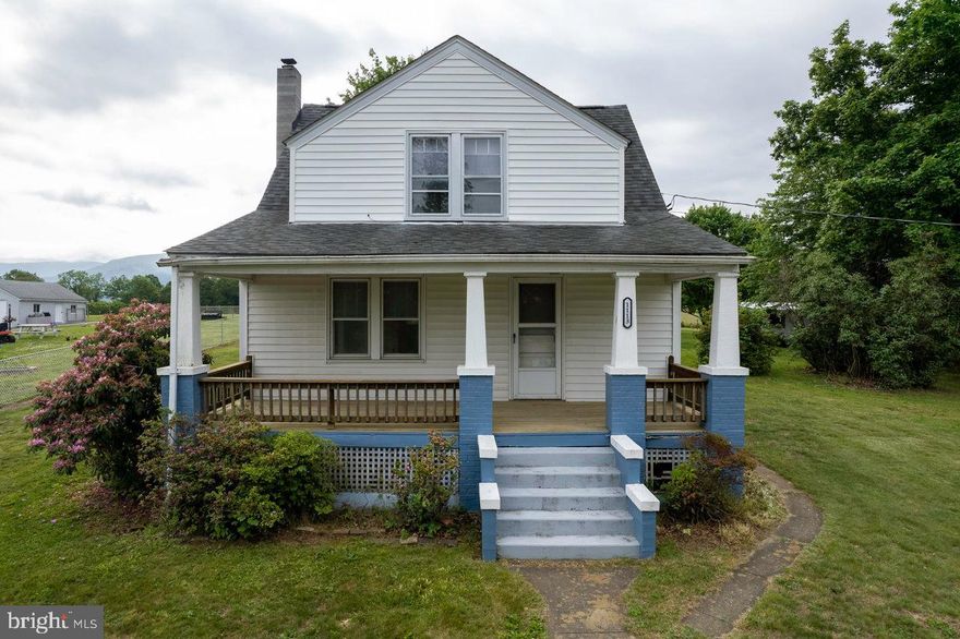 Classic Cape Cod with 2 bedrooms, 2 baths  located on 1.68 acre in town lot with a Country setting .  Enjoy the large front porch, country kitchen and numerous outbuildings . Public water & sewer!