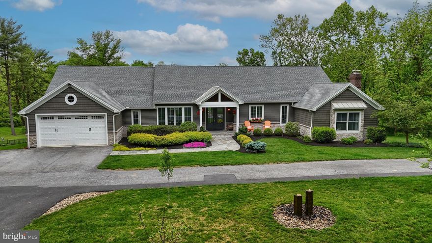 Don’t miss out on the opportunity to own a truly amazing and unique property in Dauphin County. Welcome to 600 Pine Road! Off the beaten path, offering privacy and tranquility, this home, built in 1996 was stripped down to the studs and completely remodeled in 2017 by the current owner. The entire home was transformed into a luxury modern farmhouse, with an open floor plan. The owner was pursuing her interior design degree during the time she lived there, and her education and training is evident in design and the high end, one-of-a-kind selections throughout. You will be amazed when you walk through the double ThermaTru glass front door into a wide-open foyer with custom built ins by Colonial Kraft and a peak ceiling, which then leads into a massive, open kitchen-dining-living room combination. The gourmet chef’s kitchen is so big, it boasts TWO huge islands, one with a prep sink and built-in drawer microwave oven, the other with an abundance of storage and live-edge natural wood top. A five-burner gas cook-top with custom fabricated metal range hood enhances the sight line from the living room. Finishing off the kitchen double wall ovens, a Viking beverage refrigerator and a counter depth stainless steel refrigerator, plus a walk in pantry with double refrigerator drawers and custom cabinetry. A Nana Wall fully collapsible accordion window above the main kitchen sink allows you to serve snacks to guests who are sitting outside on the deck at the window counter as they take a break from swimming in the pool. The living room, accented with shiplap walls, includes one of the 3 fireplaces – double-sided to enjoy inside on cold winter days, as well outside on chilly spring or fall evenings on the deck! On either side of the gas fireplace are tall Nana Wall accordion doors that open to the deck leading to the backyard/pool area. The deck is huge, has composite decking and stainless steel cable railings.  Continuing from the living room you’ll find the primary “resort” which includes its own private screened-in porch with vaulted ceiling, full bath with soaking tub, oversized tiled shower with heated floors and custom double vanities. This side of the house also includes a dream laundry room with more custom cabinetry and an office with a wood-burning fireplace. This could also be used as the 5th bedroom.  On the other side of the kitchen, you have two bedrooms with a Jack & Jill bathroom between them, a powder room, another drop zone with more custom cabinetry and mail/charging stations, and the garage access. Also added in the remodel is a private suite upstairs which includes a bedroom and full bath.  On to the star of the home, the backyard oasis. This extensive outdoor living space is more than anyone can dream of. The current owner invested over $500,000 in this area and it shows! An enormous concrete salt-water pool with spa, custom lighting, gas fire features, and other special touches (hello walkway inside the pool!). There is a separate large gazebo with a standing seam metal roof, and under this a large stone fireplace with a hook up for a TV above that, wood storage built in on either side, and separate ambient lighting and outlets.  A built-in barbeque that is hooked up to the property’s propane tank as well as an outdoor refrigerator and concrete countertop rounds out this space. The entertainer’s dream back yard! Also, this 7-acre lot has a pond that the current owners fish from, and easy access to the Swatara Creek, which borders the property. All of this in East Hanover Township in the Lower Dauphin School District.