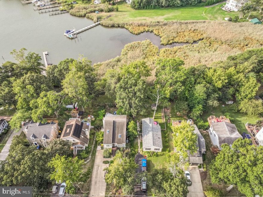PRICE ADJUSTMENT!!!! A life on the water that inspires! This cheerful contemporary home in sought-after Bay Highlands perfectly blends upscale living with relaxed coastal charm. With tall ceilings, abundant natural light, and beautifully landscaped grounds, it offers approximately 3,000 square feet of thoughtfully designed space that feels both open and inviting. Built in 1988 and freshly updated with new HVAC, fresh paint, and modern finishes, this home features three spacious bedrooms and two and a half baths. The kitchen is a true standout—equipped with stainless steel appliances, upgraded countertops, and plenty of space for casual dining. Skylights and expansive double-pane windows fill the home with natural light and capture serene views of Oyster Creek. The main level offers effortless flow between the kitchen, living, family, and sunroom spaces—all designed for easy entertaining or quiet evenings overlooking the water from the spacious rear deck. Upstairs, the primary suite is a retreat of its own, featuring a walk-in closet, sleek spa bath with walk-in shower, and a private balcony that opens to peaceful creek views. Two additional bedrooms provide flexibility for guests, a home office, or a creative studio. The finished daylight lower level extends your living space with a cozy TV room, workshop area, and walkout access—ideal for hobbies or recreation. Step outside to discover your own backyard oasis: lush landscaping, hardscaping designed for easy entertaining, and wide-open views of Oyster Creek thanks to the lot backing to community open space. With parking for three to four cars, a community dock for kayaking and paddleboarding, and proximity to Quiet Waters Park, Eastport, and downtown Annapolis, this property offers a lifestyle of connection, recreation, and tranquility all in one. Bay Highlands is truly one of Annapolis’ hidden treasures—an established waterfront community where neighbors gather, kids play freely, and every sunrise feels special. Imagine the magic of moving in just in time to create new memories and holiday traditions in this peaceful, picturesque setting. 1193 Bay Highlands Drive—more than a home, it’s a place to celebrate life on the Chesapeake and make every day feel like a getaway.